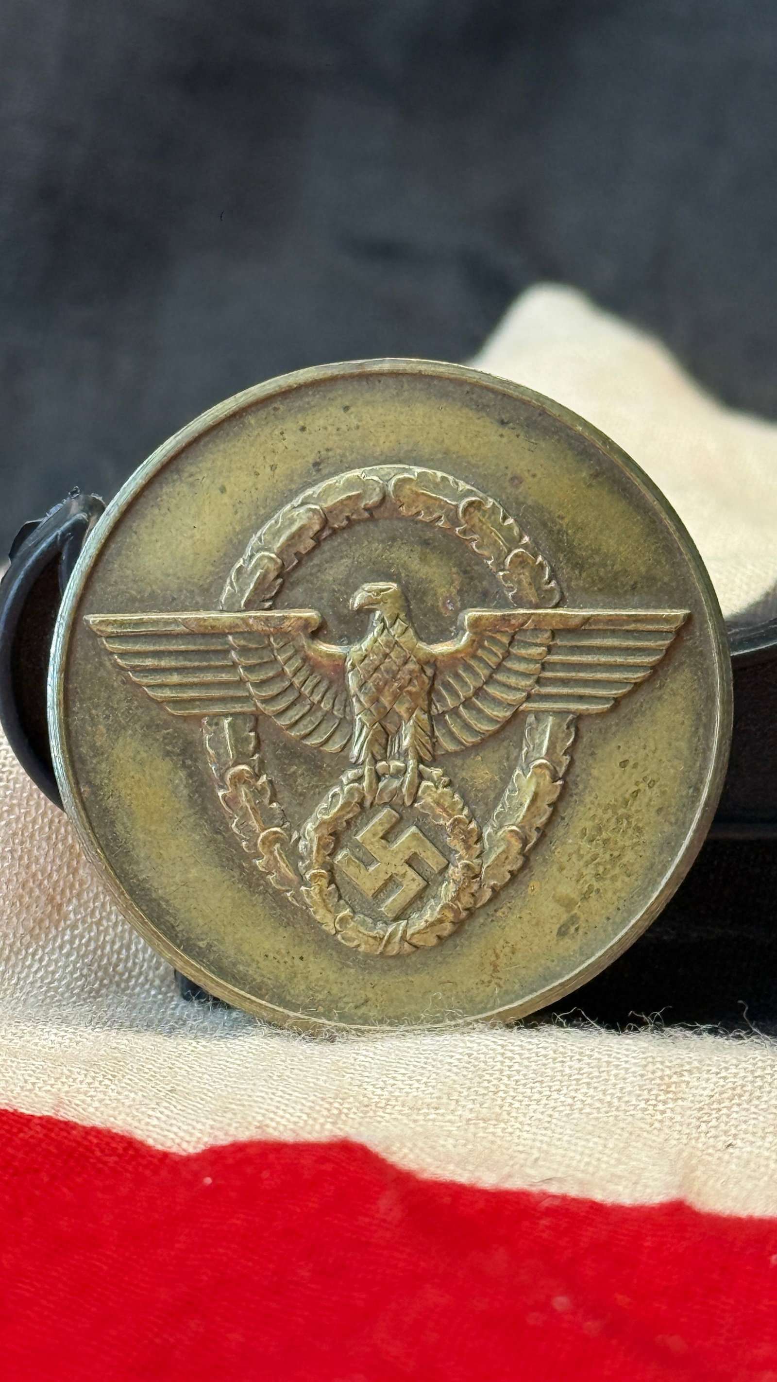 WWII German NSDAP "Treue Dienste in der NSDAP" Commemorative Medallion: This bronze-toned circular medallion features the national eagle above a wreath enclosing a swastika on the obverse, while the reverse is inscribed "Treue Dienste in der NSDAP" ("Faithful Service in t