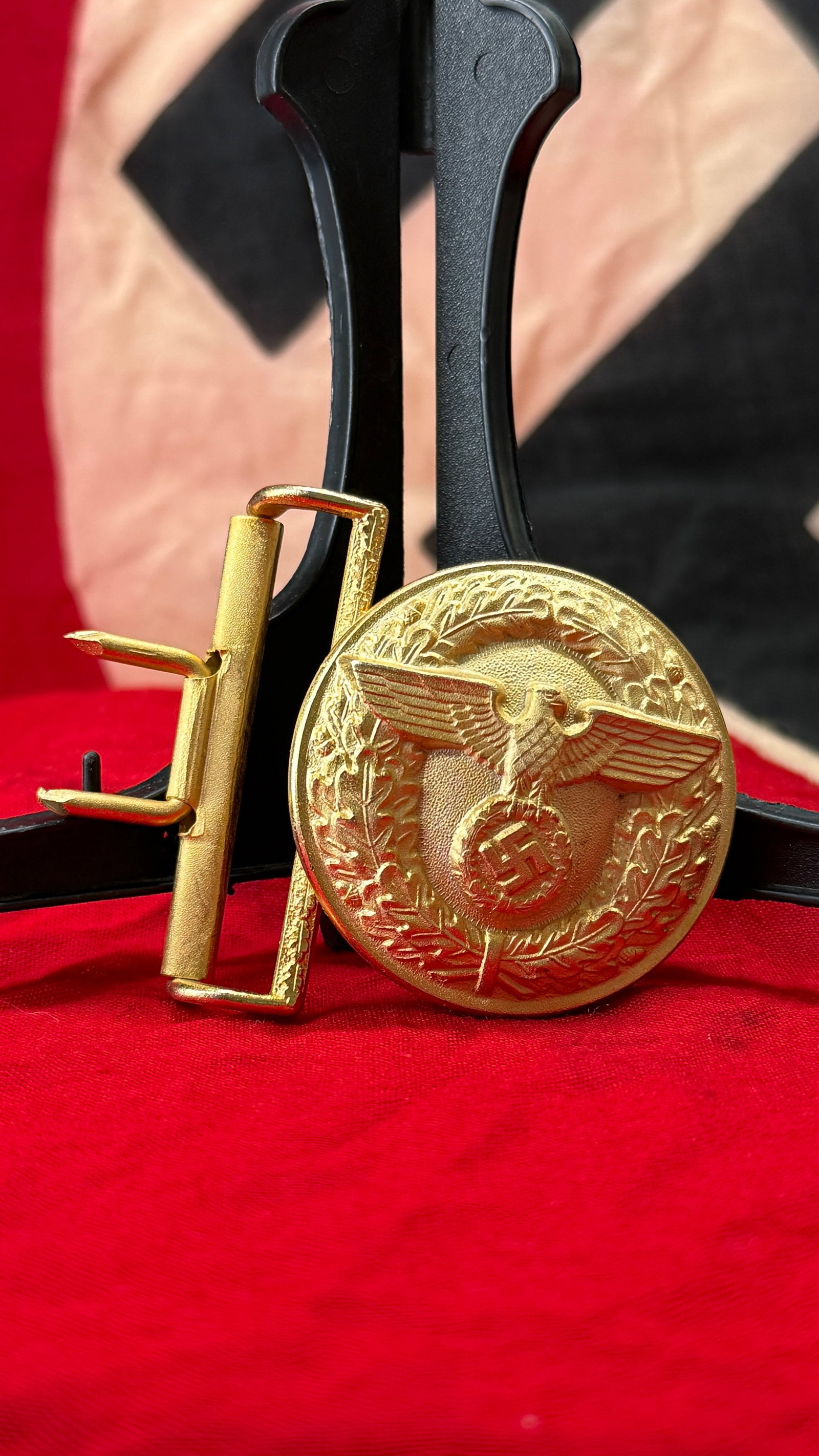 WWII German NSDAP Political Leader's Belt Buckle (RZM M4/24): This World War II German NSDAP Political Leader's belt buckle features a gilt-finished circular design with the national eagle standing above an oak leaf wreath enclosing a swastika. The reverse is ma