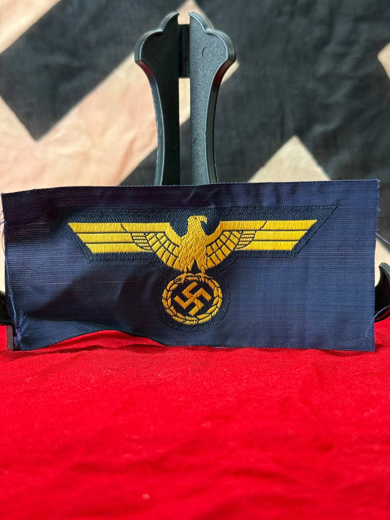 WWII German Kriegsmarine Enlisted Man's/NCO's BeVo Breast Eagle: This World War II German Kriegsmarine flat-woven BeVo breast eagle is embroidered in golden-yellow thread on a dark navy cloth backing, depicting the national eagle above an oak leaf wreath enclosing 