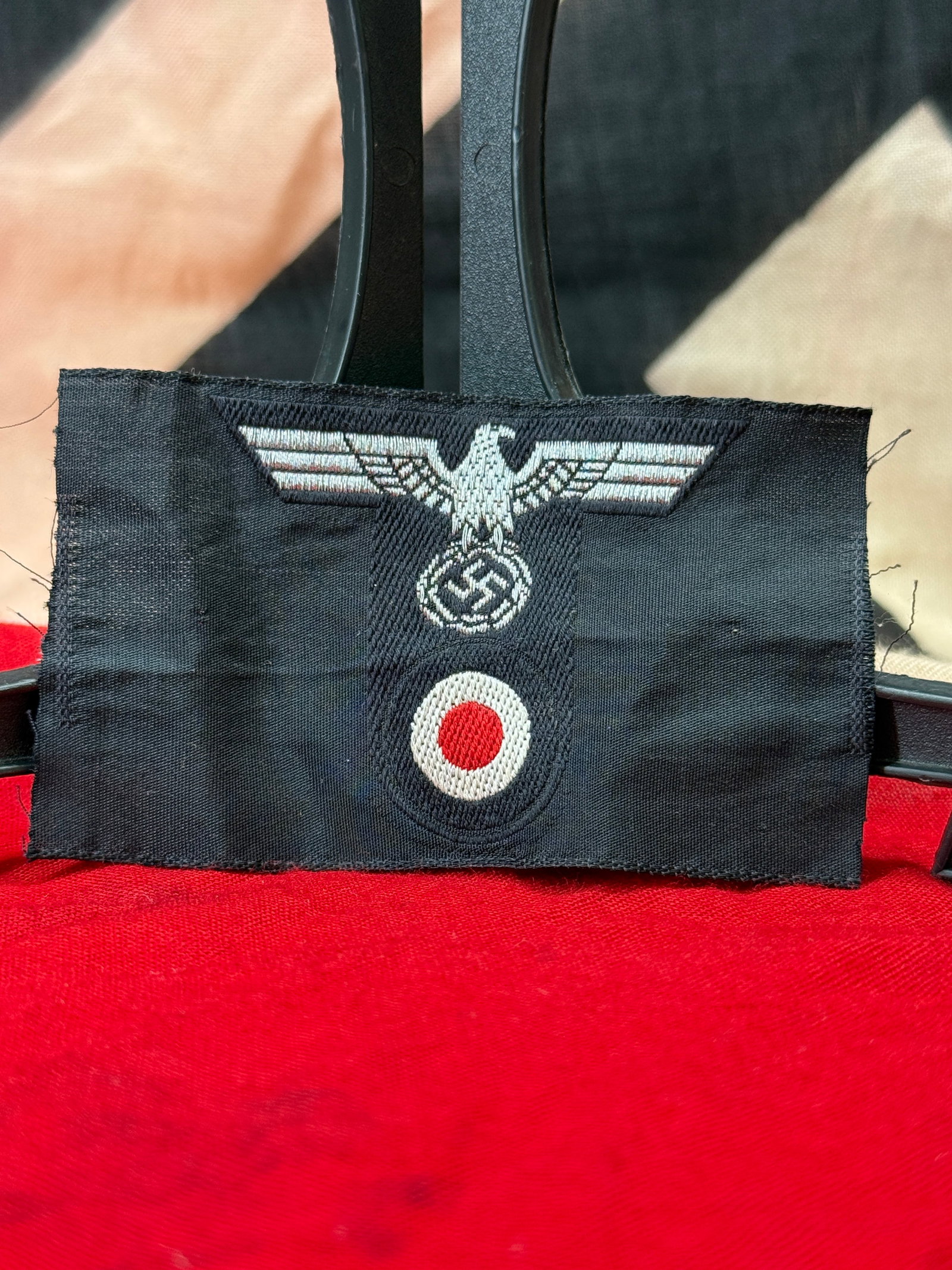 WWII German Heer BeVo Panzer M43 Cap T-Eagle & Cockade Trapezoid: This machine-woven BeVo insignia consists of the German Heer national eagle positioned above the red, white, and black national cockade, all mounted on the characteristic black trapezoidal backing use