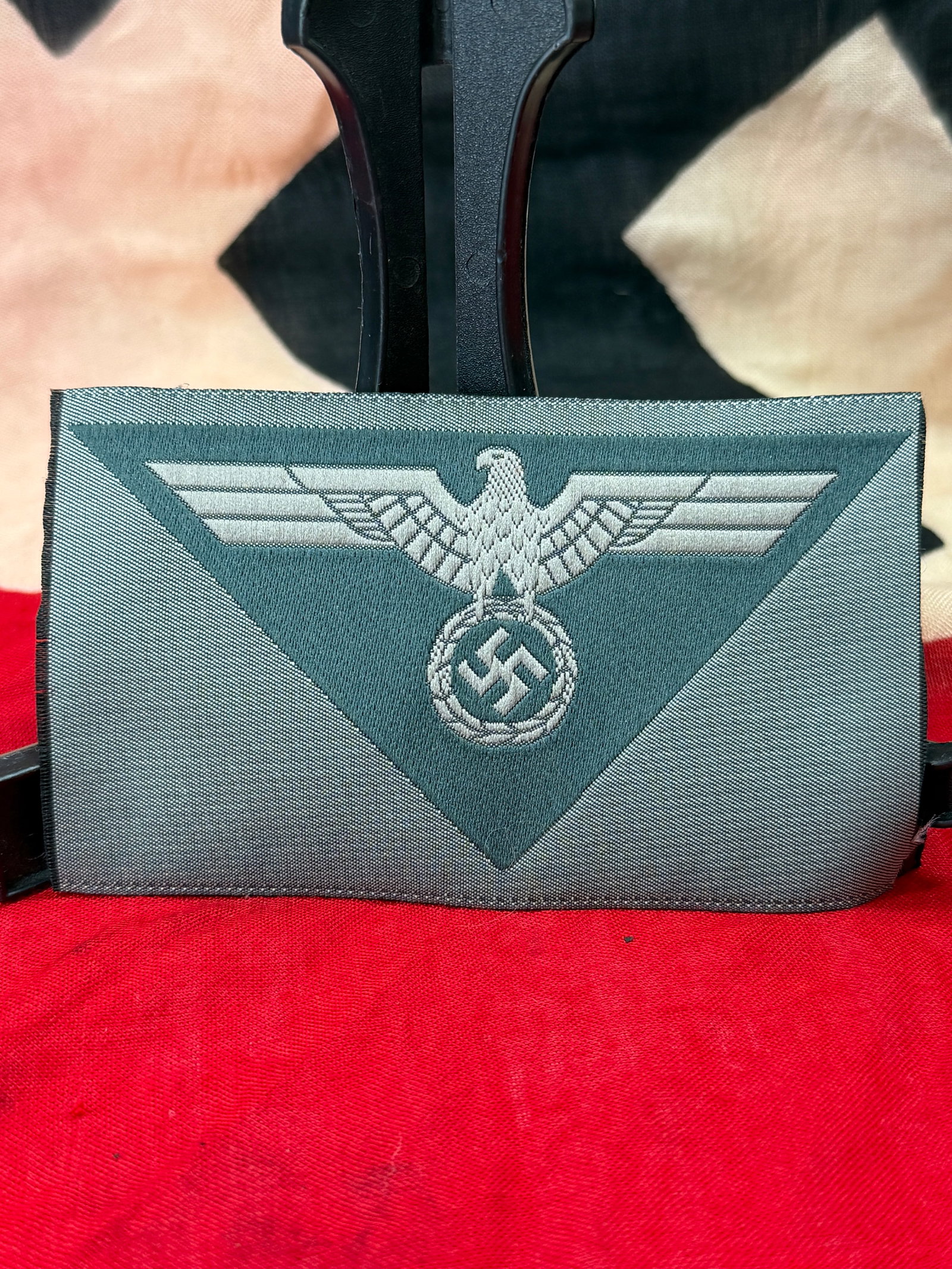 WWII German Army (Heer) M39/M44 BeVo Woven Breast Eagle Insignia: This woven BeVo breast eagle features the German Army (Heer) national emblem with outstretched wings above a wreath enclosing the swastika, executed in silver-gray thread on a field-gray triangular ba