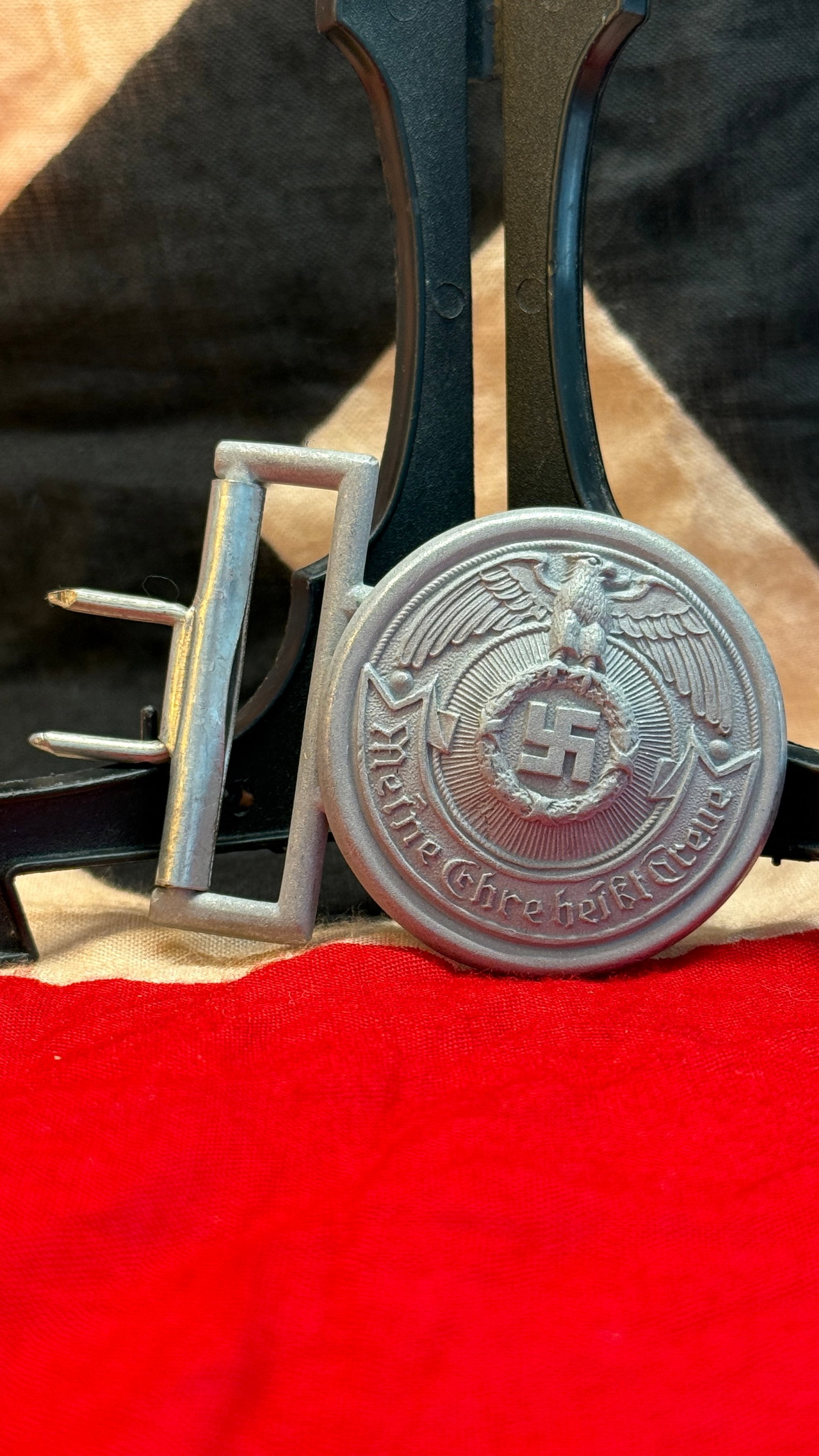 WWII German Waffen-SS Officer's Belt Buckle: This aluminum two-piece Waffen-SS officer's belt buckle features the national eagle above the SS runes encircled by an oak leaf wreath and the famous Waffen-SS motto "Meine Ehre heißt Treue" ("My Hon