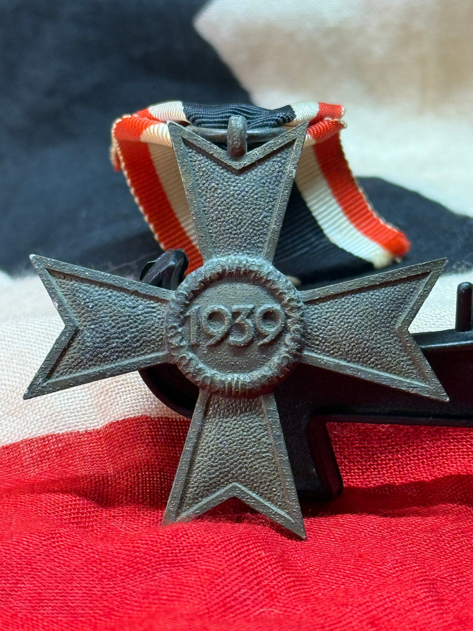 WWII German War Merit Cross 2nd Class Without Swords Medal: Instituted on October 18, 1939, the War Merit Cross 2nd Class Without Swords (Kriegsverdienstkreuz II. Klasse ohne Schwerter) recognized noteworthy civilian or military service performed in support of