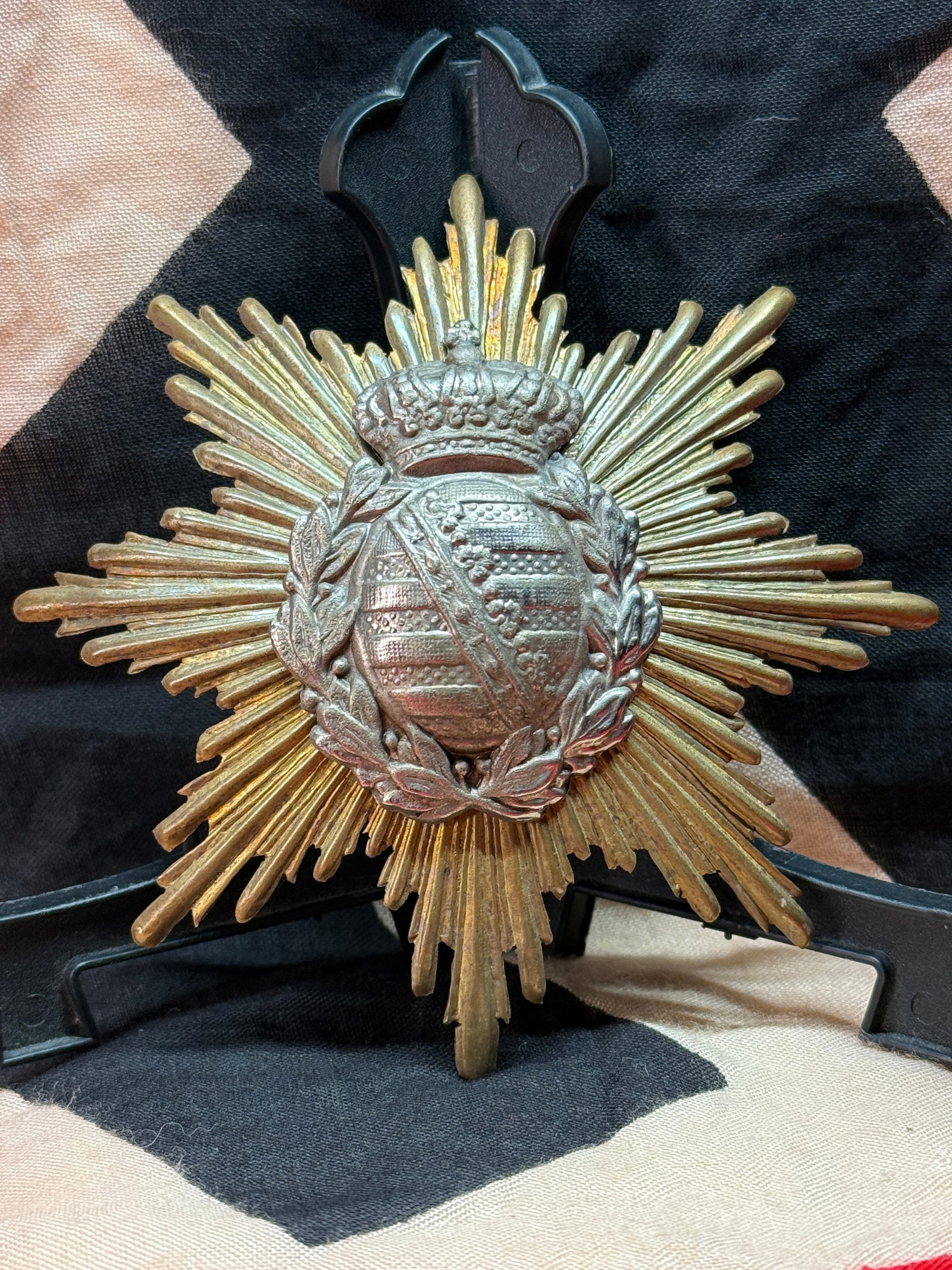 Imperial German Kingdom of Saxony Order Breast Star: This elaborate multi-rayed gilt and silvered breast star features the crowned coat of arms of the Kingdom of Saxony enclosed within a laurel wreath. Such stars accompanied the highest grades of Saxon 