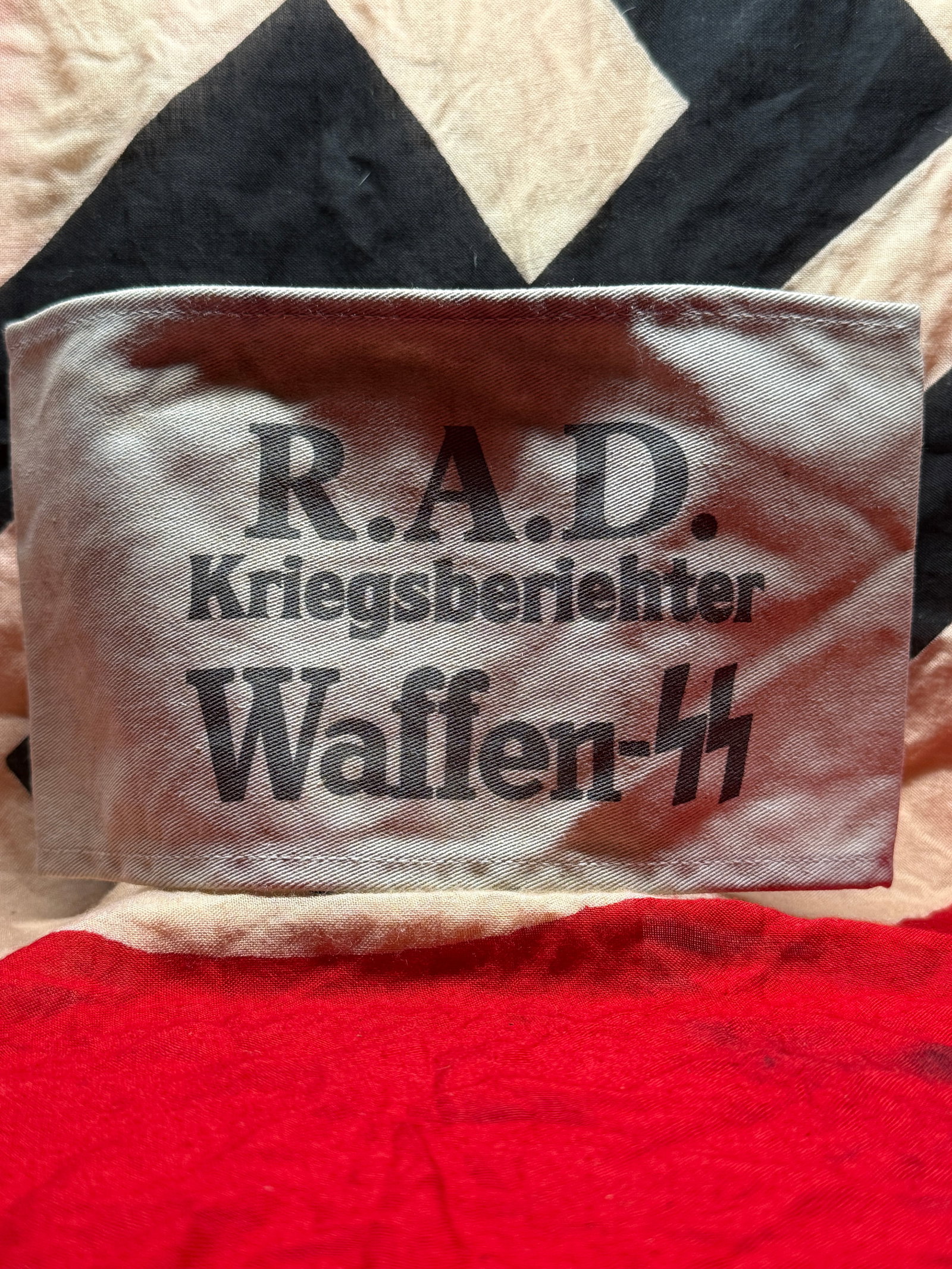 WWII German Waffen-SS War Correspondent (Kriegsberichter) Armband: This white cloth armband is printed with the designation "R.A.D. Kriegsberichter Waffen-SS," identifying a war correspondent assigned to report on Waffen-SS military operations. War correspondents doc