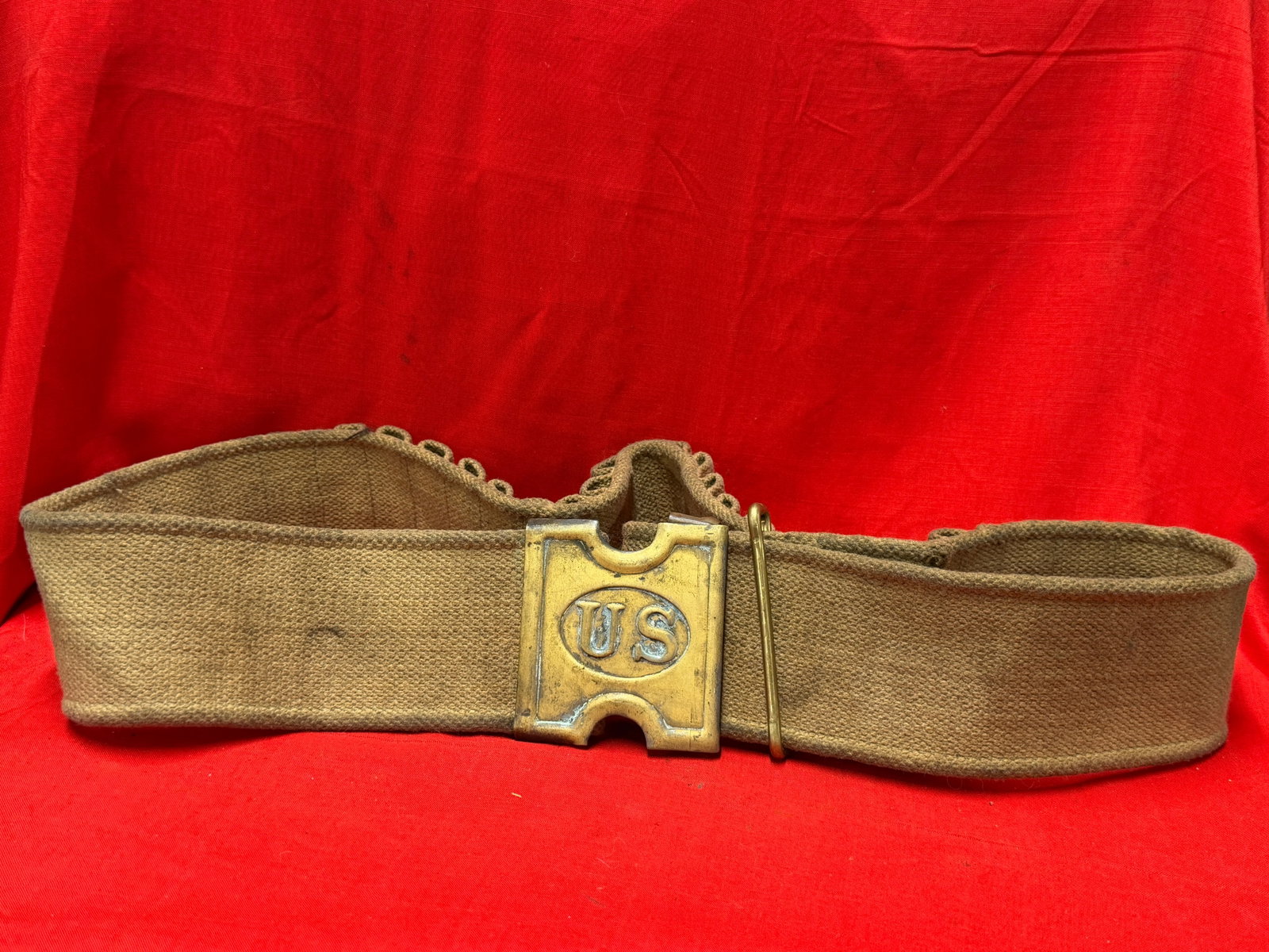 Spanish-American War U.S. Army Mills Woven Canvas Cartridge Belt with Brass "US" Buckle: This Spanish-American War era U.S. Army Mills woven canvas cartridge belt features the iconic brass "US" rectangular plate buckle and an integrated series of woven ammunition pockets designed for .30-