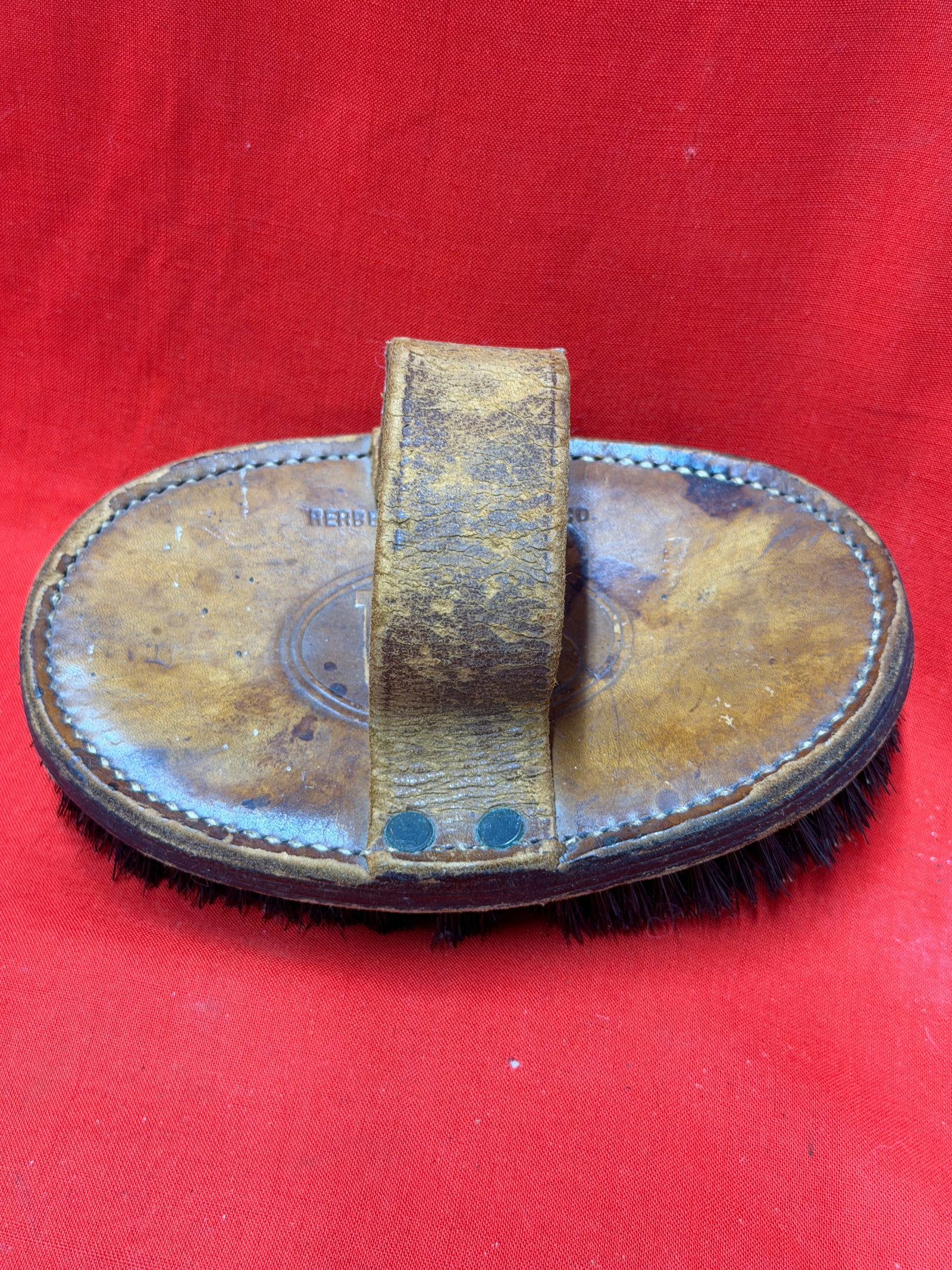 Civil War U.S. Cavalry Horse Grooming Brush – Herbert Brush Company: This leather-backed horse grooming brush is marked "HERBERT BRUSH CO." and features a large embossed "U.S." within an oval on the reverse, indicating manufacture for military use. The sturdy leather h