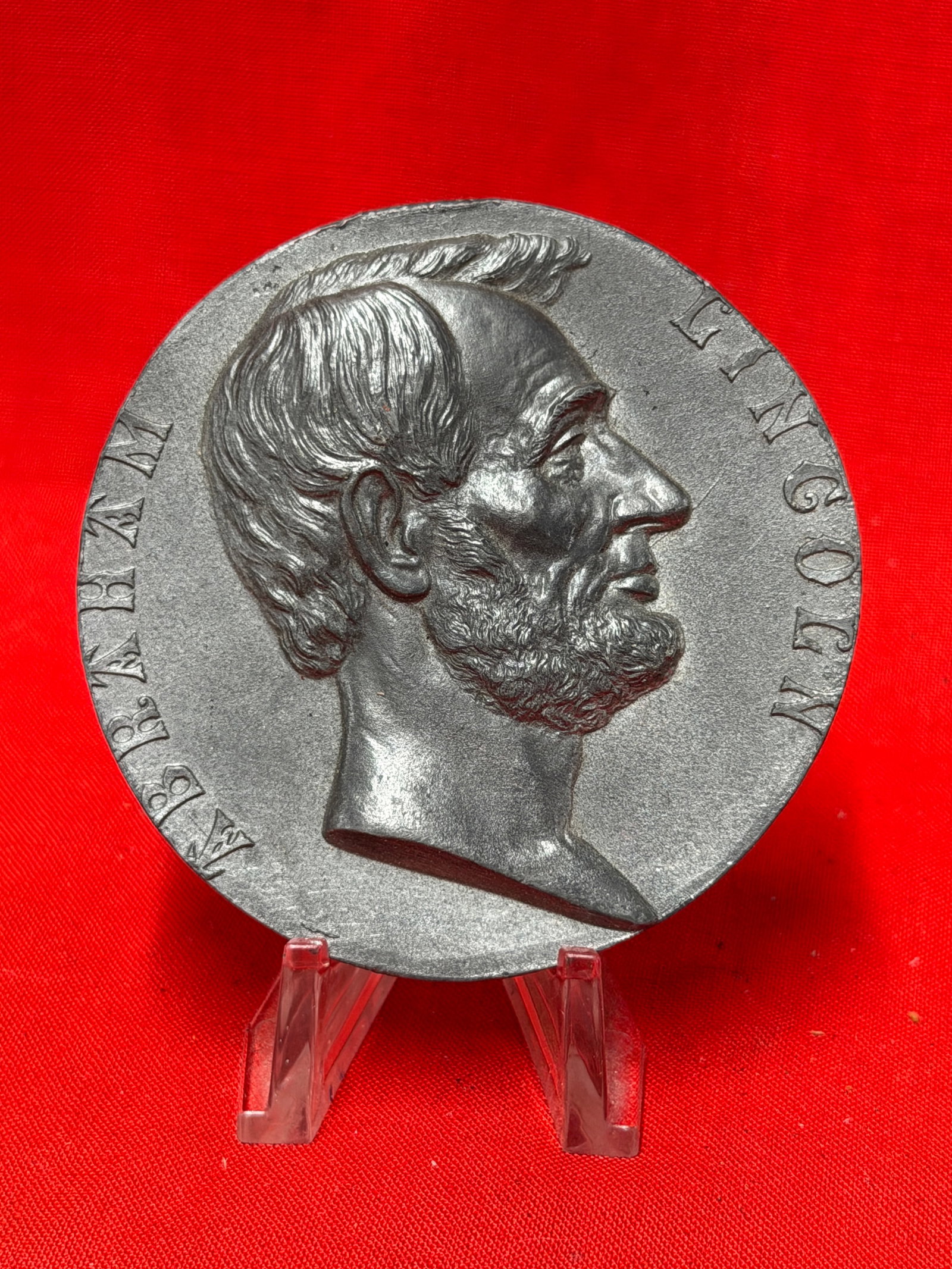 Abraham Lincoln Civil War Presidential Memorial Medallion: This commemorative medallion features a right-facing portrait of President Abraham Lincoln on the obverse, surrounded by his name, while the reverse bears the inscription: "Inaugurated President of th