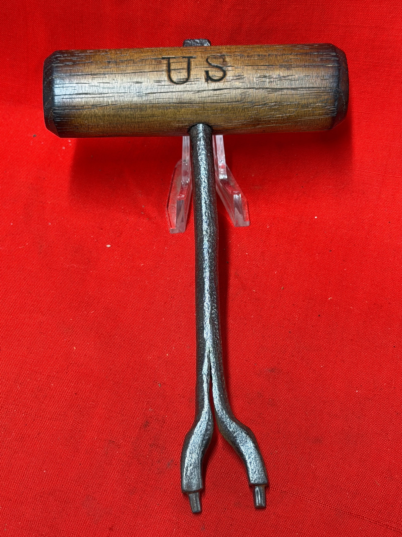 Civil War U.S. Combination Gun Tool with "US" and "E.W." Marked Wooden Handle: This Civil War combination gun tool features a forged iron two-prong head mounted in a turned hardwood handle prominently marked "US" on one side and "E.W." on the opposite side. These compact tools w