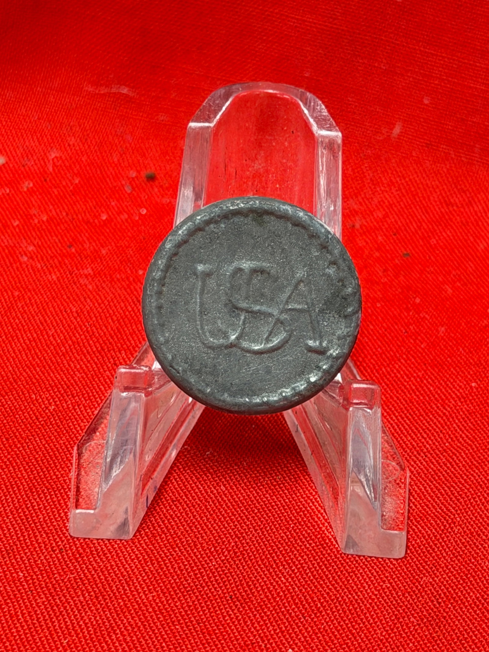 Revolutionary War Early Variant USA Rope Edge Pewter Coat Button: This early variant Revolutionary War "USA" pewter coat button features the distinctive interlocking USA monogram surrounded by an attractive raised rope-edge border, a scarce design associated with th