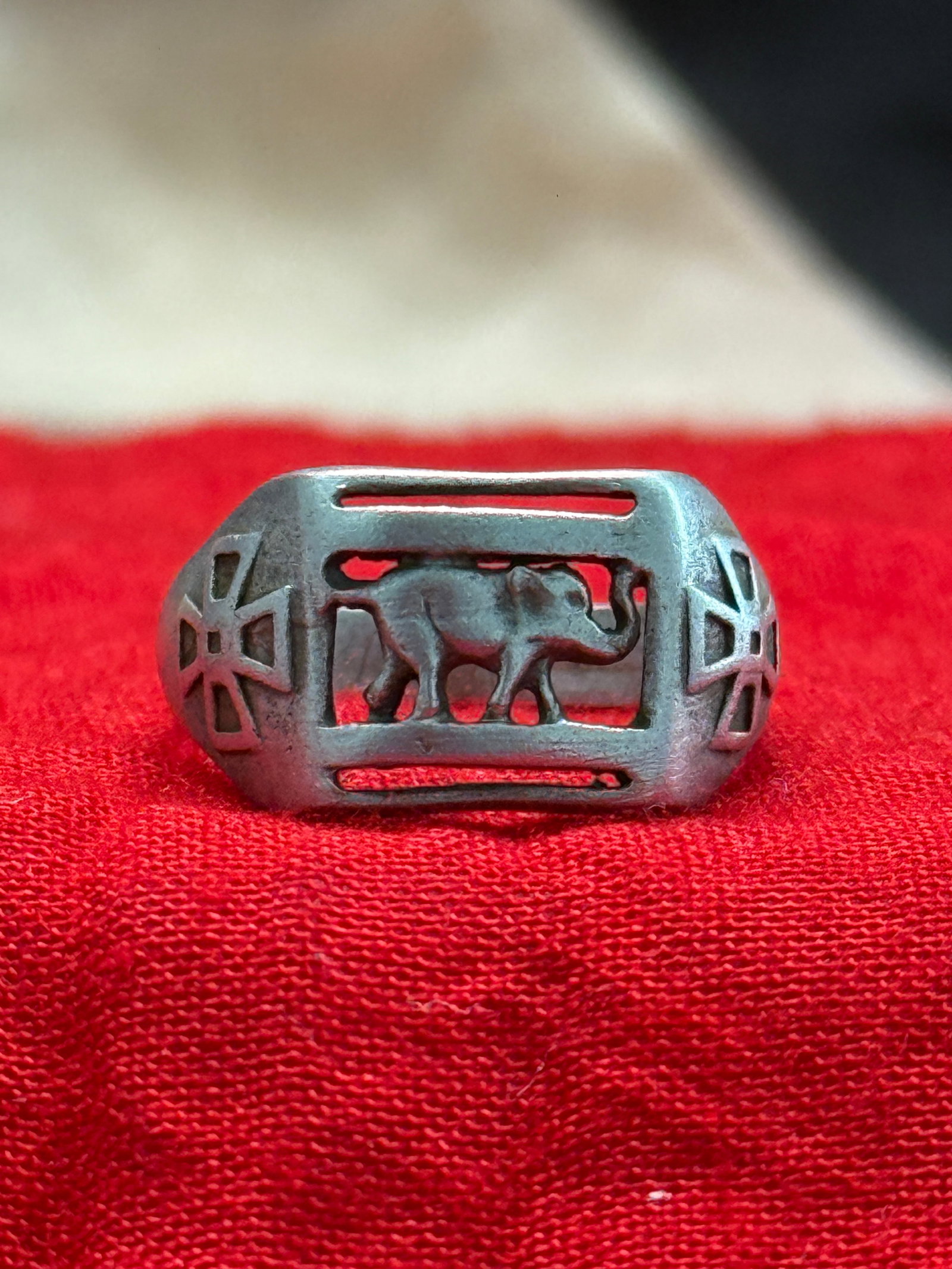 WWII German Waffen-SS Division Silver Ring with Elephant Motif: This WWII German Waffen-SS Division Silver Ring features an openwork rectangular bezel depicting an elephant in profile, with stylized cross motifs decorating each shoulder of the band. The interior i