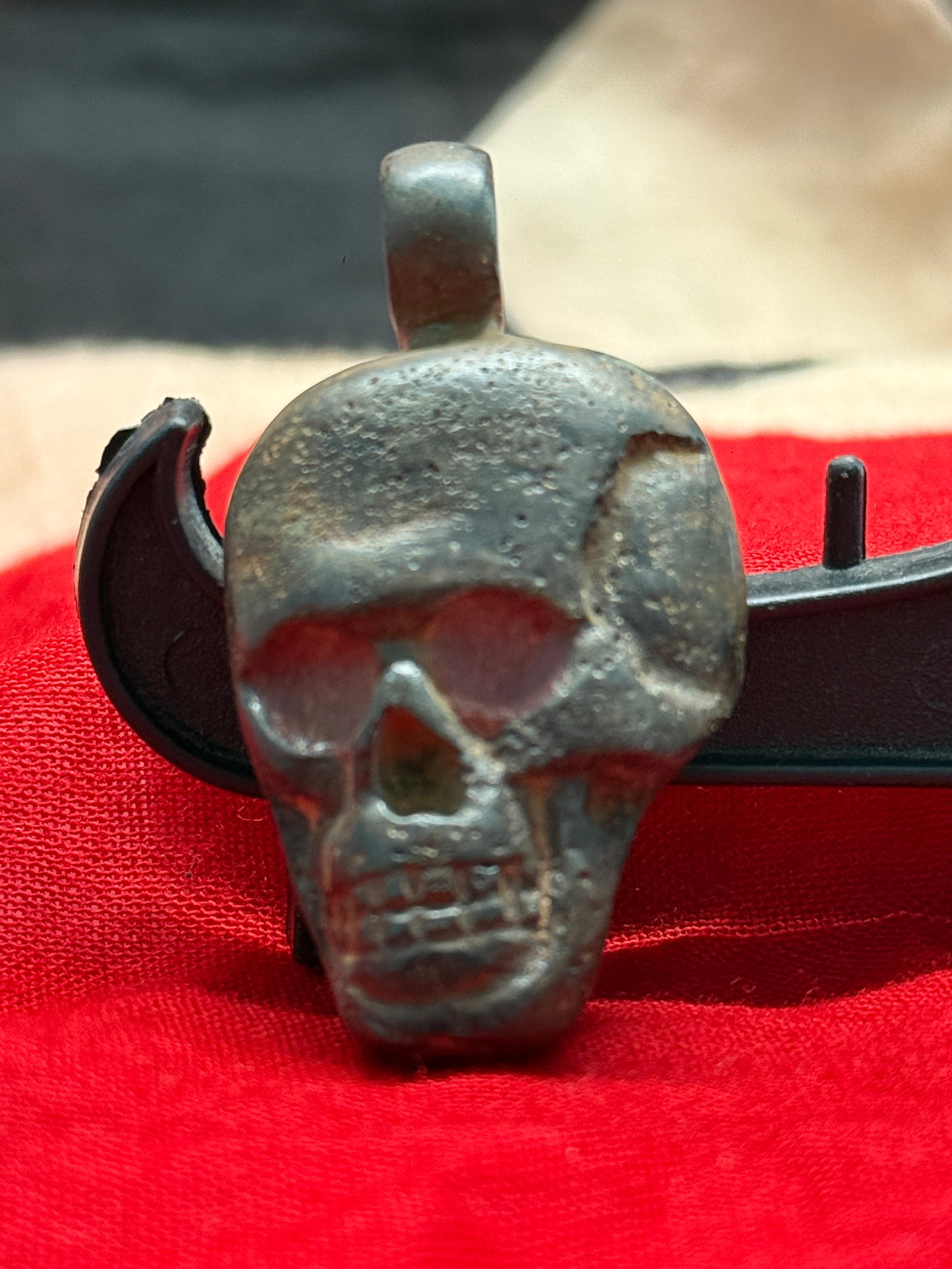 WWII German Totenkopf Silver Skull Pendant: This pendant is cast in the form of a human skull, commonly referred to by the German term "Totenkopf." Skull imagery has long held military symbolism in Germany and was widely employed by several org