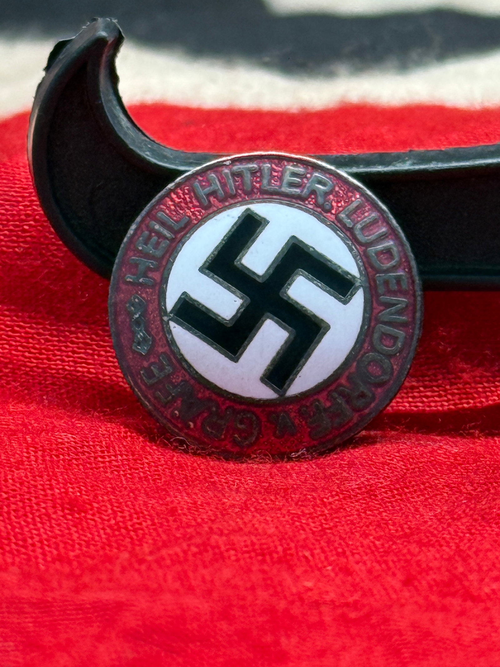 WWII German Hitler Youth (Hitlerjugend) Membership Badge – M1/73 Marked: The Hitler Youth Membership Badge was worn by members of the Hitlerjugend, the official youth organization of the National Socialist regime. Featuring the red enamel border inscribed "Hitler Jugend," 
