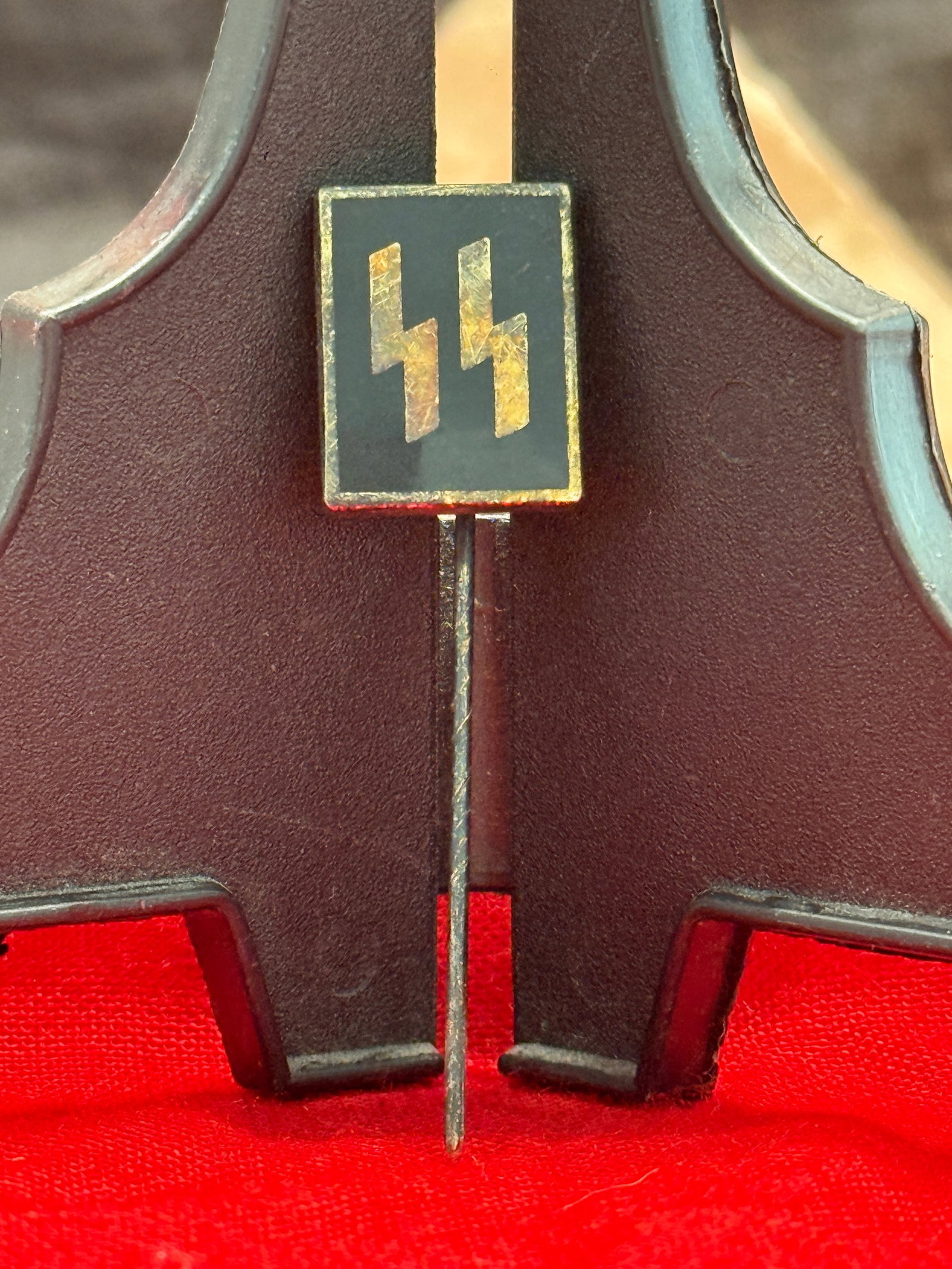 WWII German Waffen-SS Stick Pin – M1/83 Marked: This miniature Waffen-SS stick pin features the distinctive twin Sig runes in silver against a black background within a square field. The reverse bears the maker code "M1/83," identifying production 