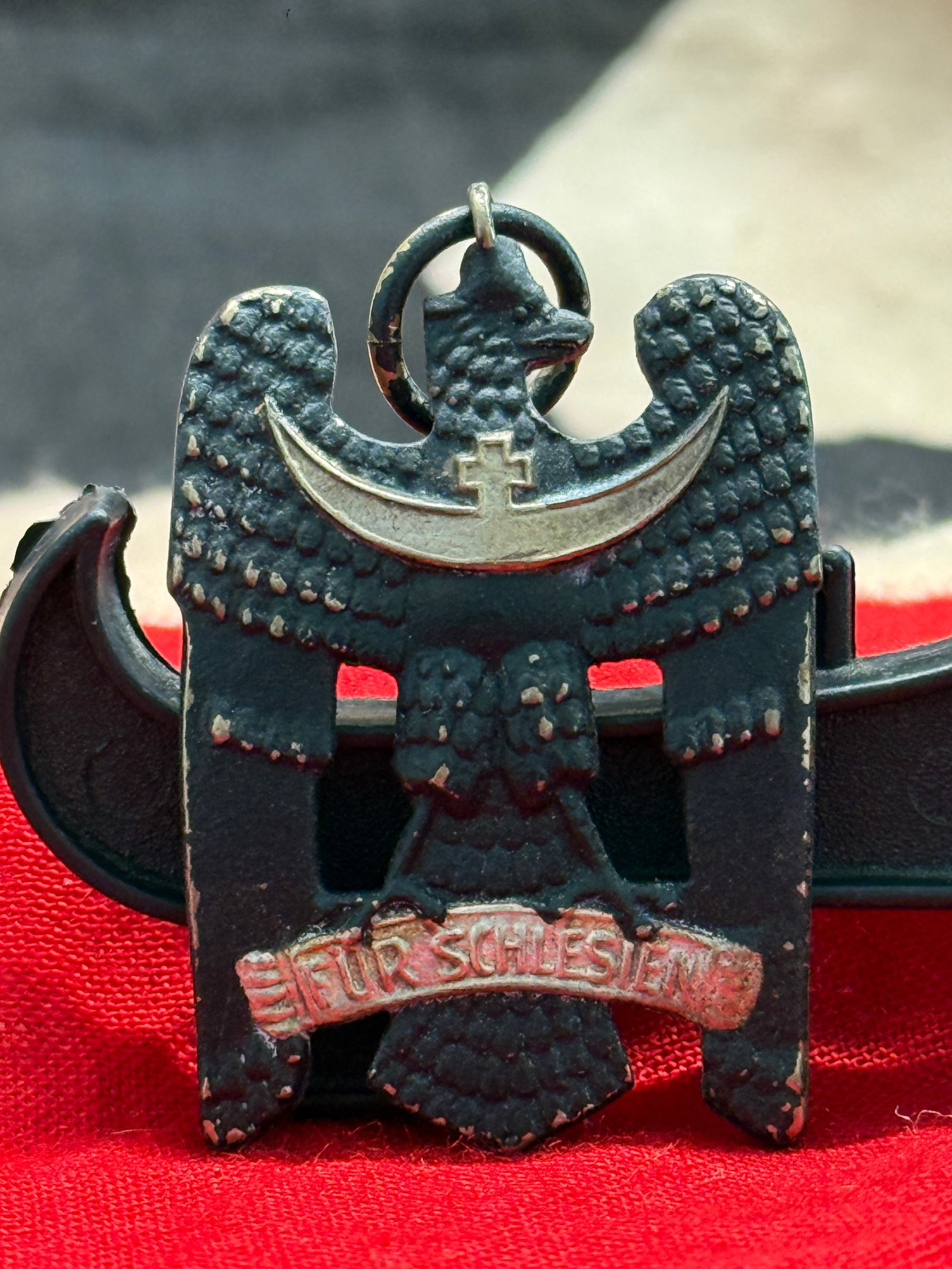 WW2 German Weimar Republic Silesian Eagle 2nd Class Medal (Schlesischer Adler): This medal features the black Silesian eagle bearing a silver crescent and cross across its breast above the inscription "Für Schlesien" ("For Silesia"). Suspended by its original ring, this example 
