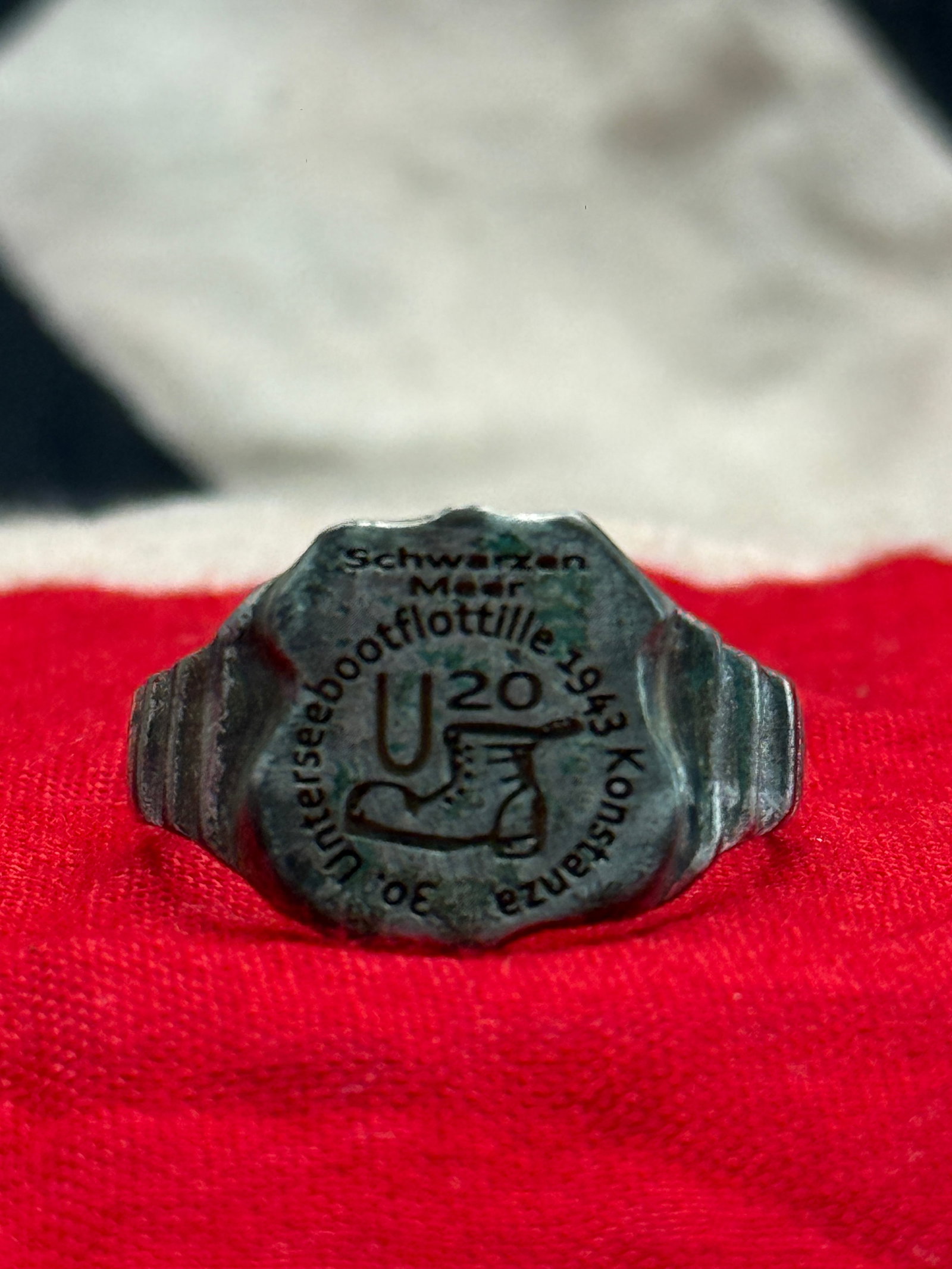 WWII German Kriegsmarine Black Sea U-Boat Flotilla Commemorative Silver Ring: This ring bears the inscription "Schwarzes Meer Unterseebootflottille 1943 Konstanza 30" surrounding a U-boat emblem and naval boot motif. The inscription references the German Kriegsmarine's Black Se