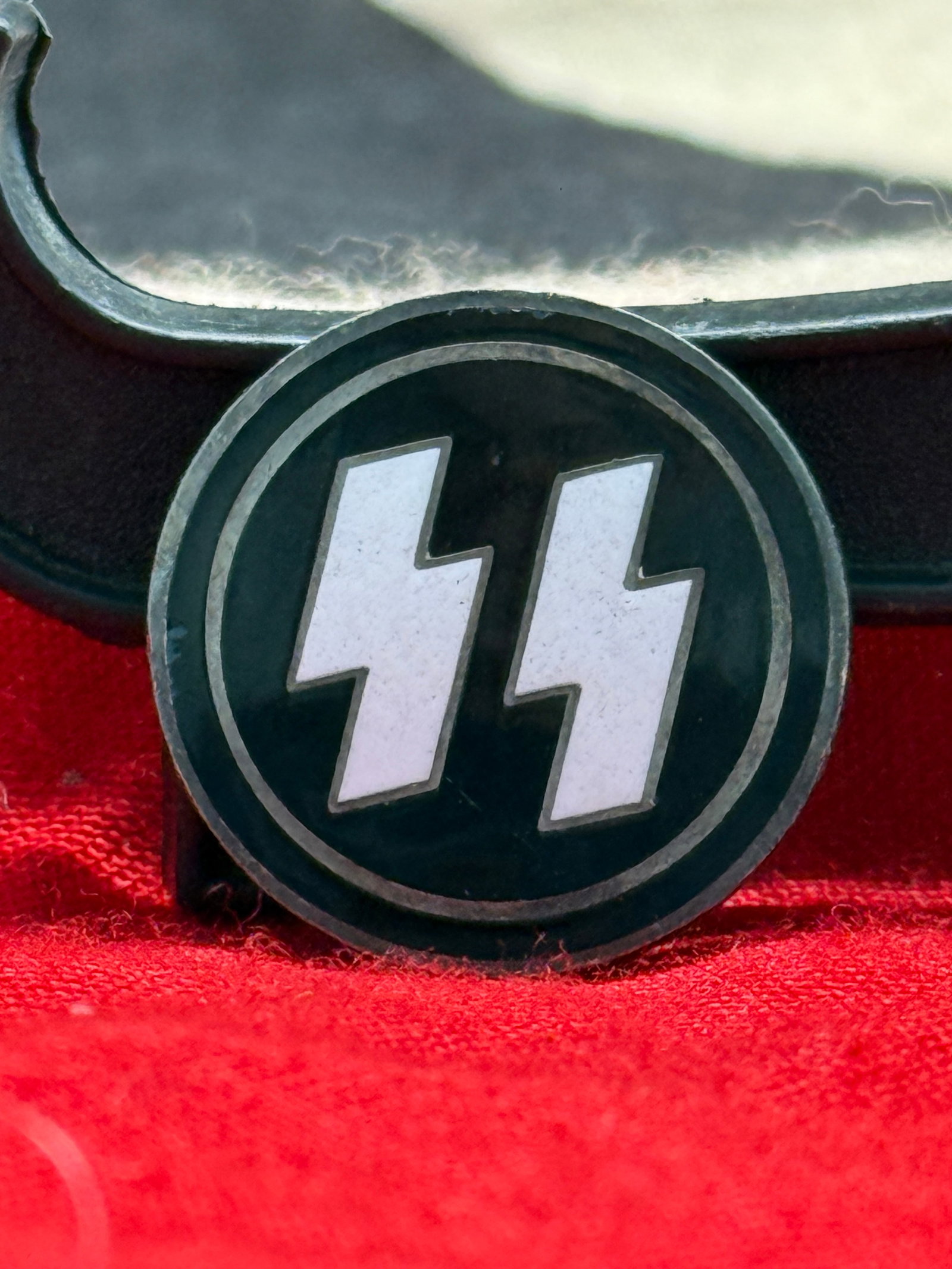 WWII German Waffen-SS Double Sig Rune Membership Lapel Pin: This German WWII Waffen-SS lapel pin displays the unmistakable double Sig Rune emblem in white against a black circular field. The reverse retains its original pinback assembly with a textured backing