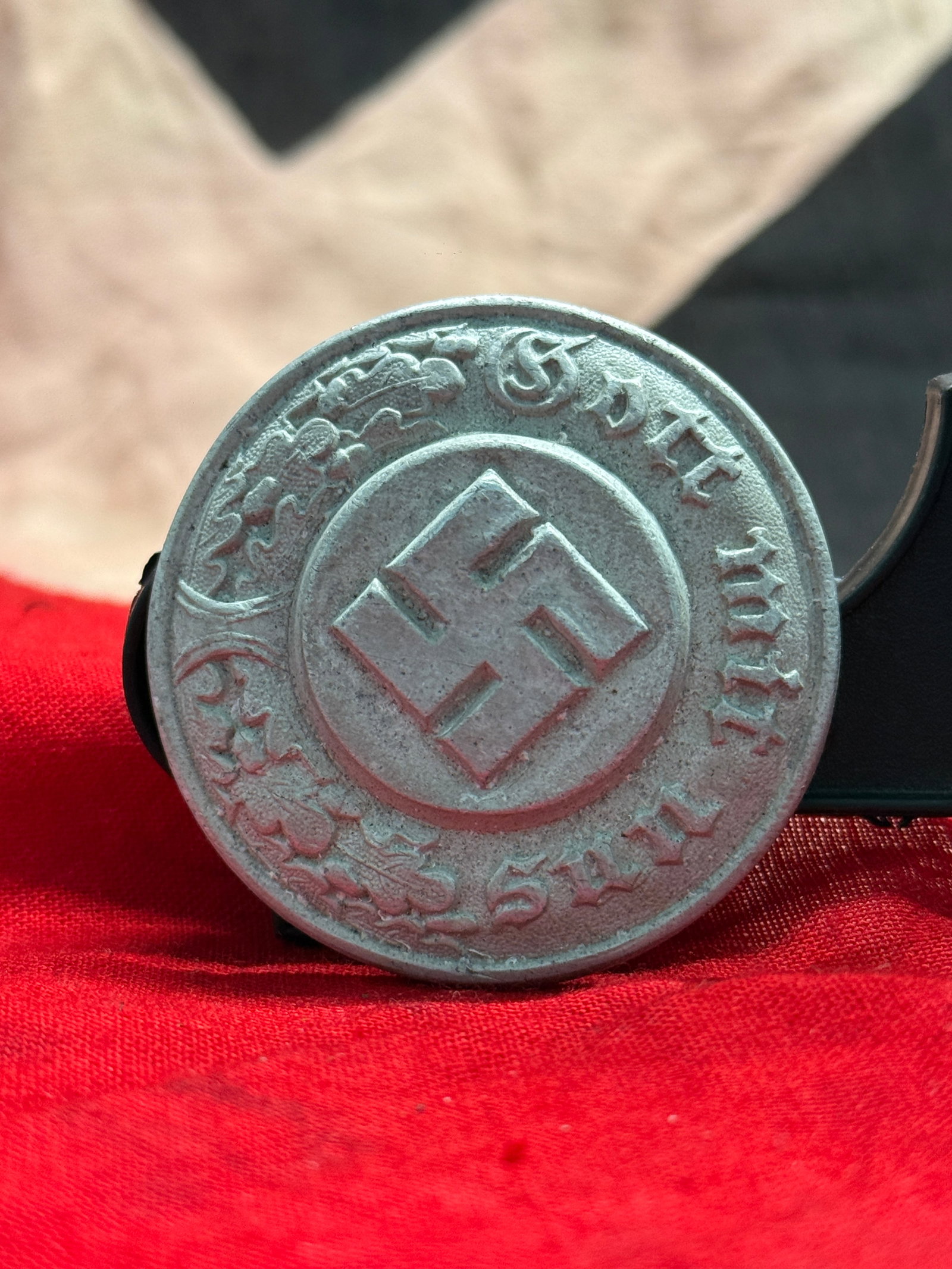 WWII German SA Sports Badge (SA-Sportabzeichen): This circular metal badge displays the intertwined SA monogram surrounded by the inscription "Für Leistungen im SA-Sport" ("For Achievement in SA Sports"). Awarded to individuals who successfully com