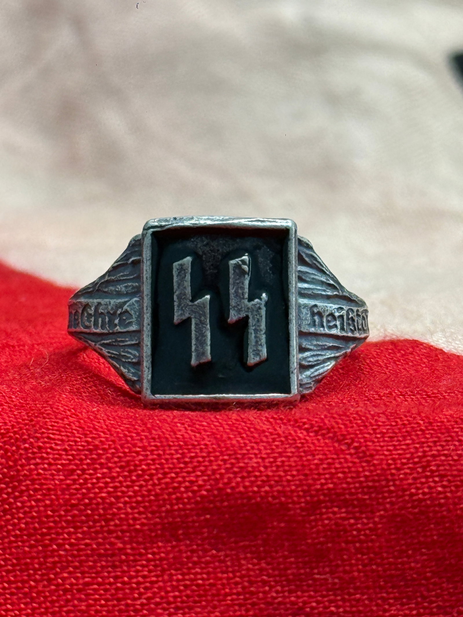 WWII German Waffen-SS "Meine Ehre Heißt Treue" Honor Silver Ring By DRGM: This ring features the iconic Waffen-SS double Sig runes mounted on a black enamel-style face, with the inscription "Meine Ehre heißt Treue" ("My Honor Is Loyalty") engraved along both shoulders. The