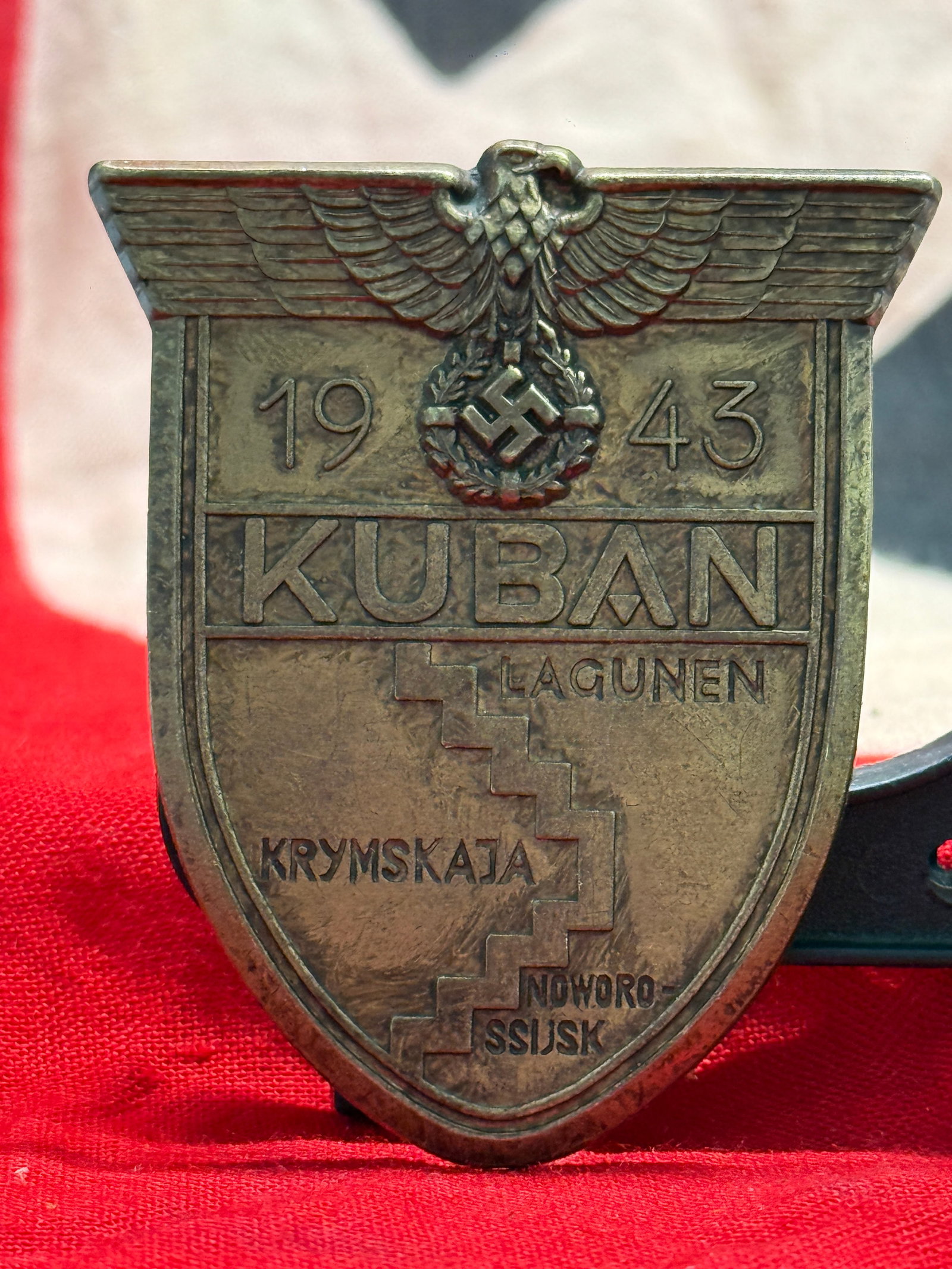 WWII German Kuban Campaign Shield (Kuban Shield 1943): The Kuban Campaign Shield commemorates German service in the Kuban bridgehead campaign on the Eastern Front between February and October 1943. The shield bears the national eagle above a swastika wrea