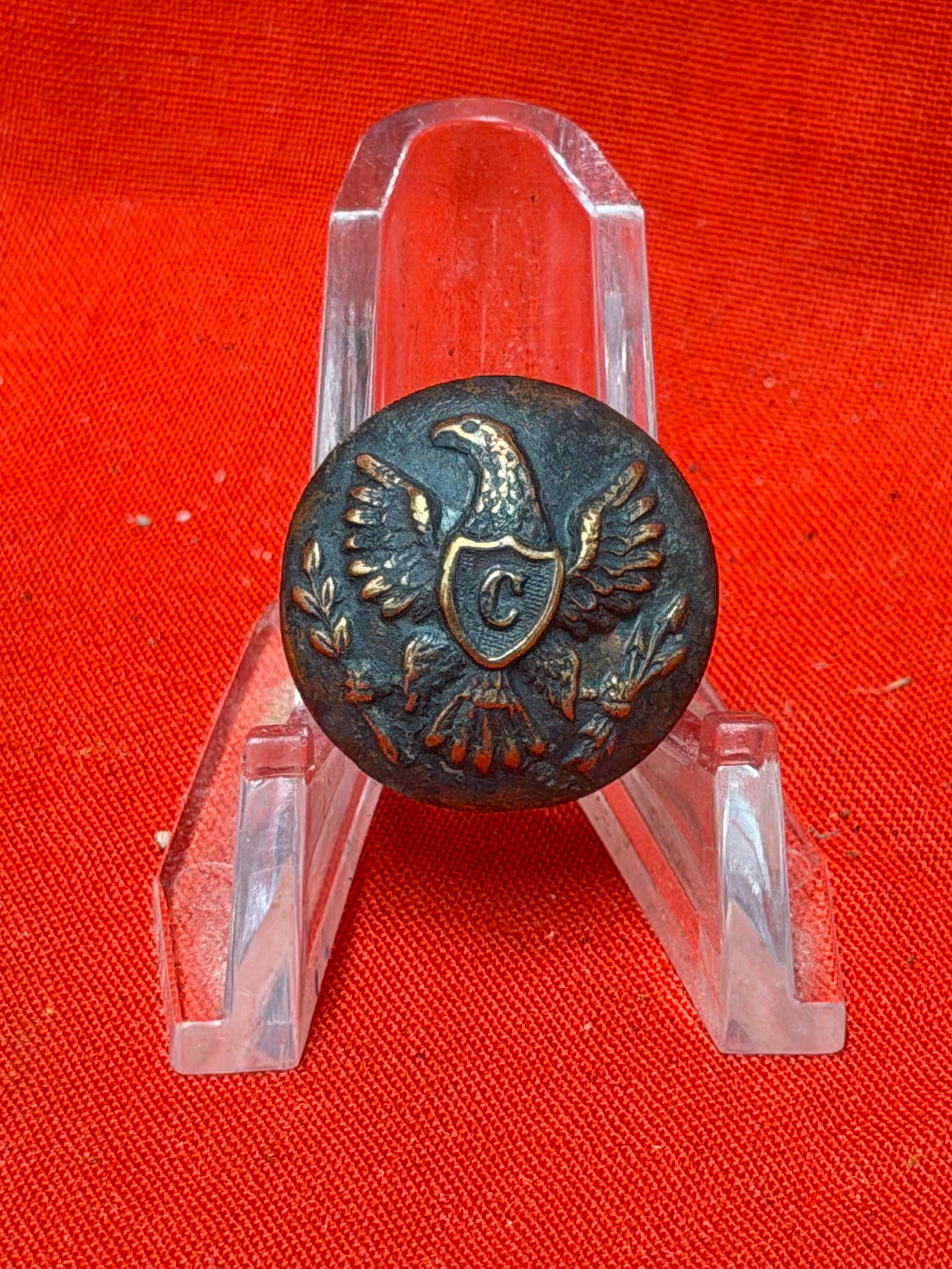 Civil War Union Cavalry Eagle Coat Button - Maker Marked: This Civil War Union Cavalry Eagle Coat Button features the Federal spread-wing eagle with a shield bearing the raised "C" denoting the Cavalry branch of service. The reverse retains its original shan