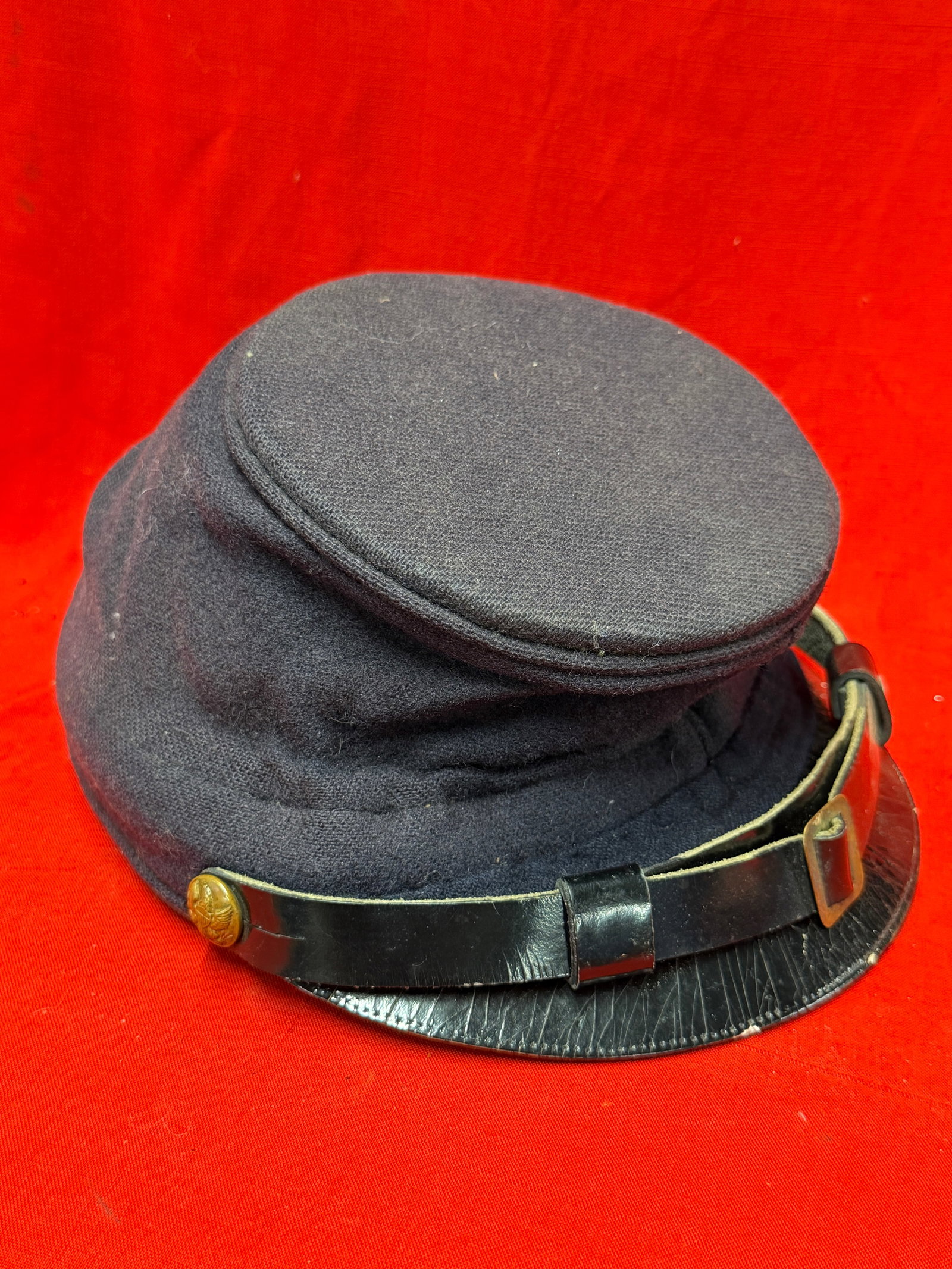 Civil War Union Infantry Forage Cap Hat Kepi (McDowell Pattern): This Civil War Union Infantry Forage Cap, commonly known as the McDowell Pattern forage cap, is constructed of dark blue wool with a black leather visor, leather chinstrap secured by Federal eagle but