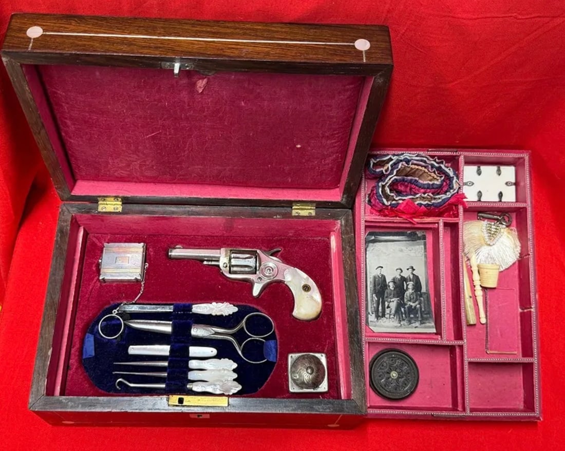 1800s Lady of the Evening Companion Vanity & Personal Protection Set: This elegant 1800s Lady of the Evening companion set is housed in a finely crafted wooden presentation case with decorative inlaid accents and a richly fitted velvet-lined interior. The collection inc