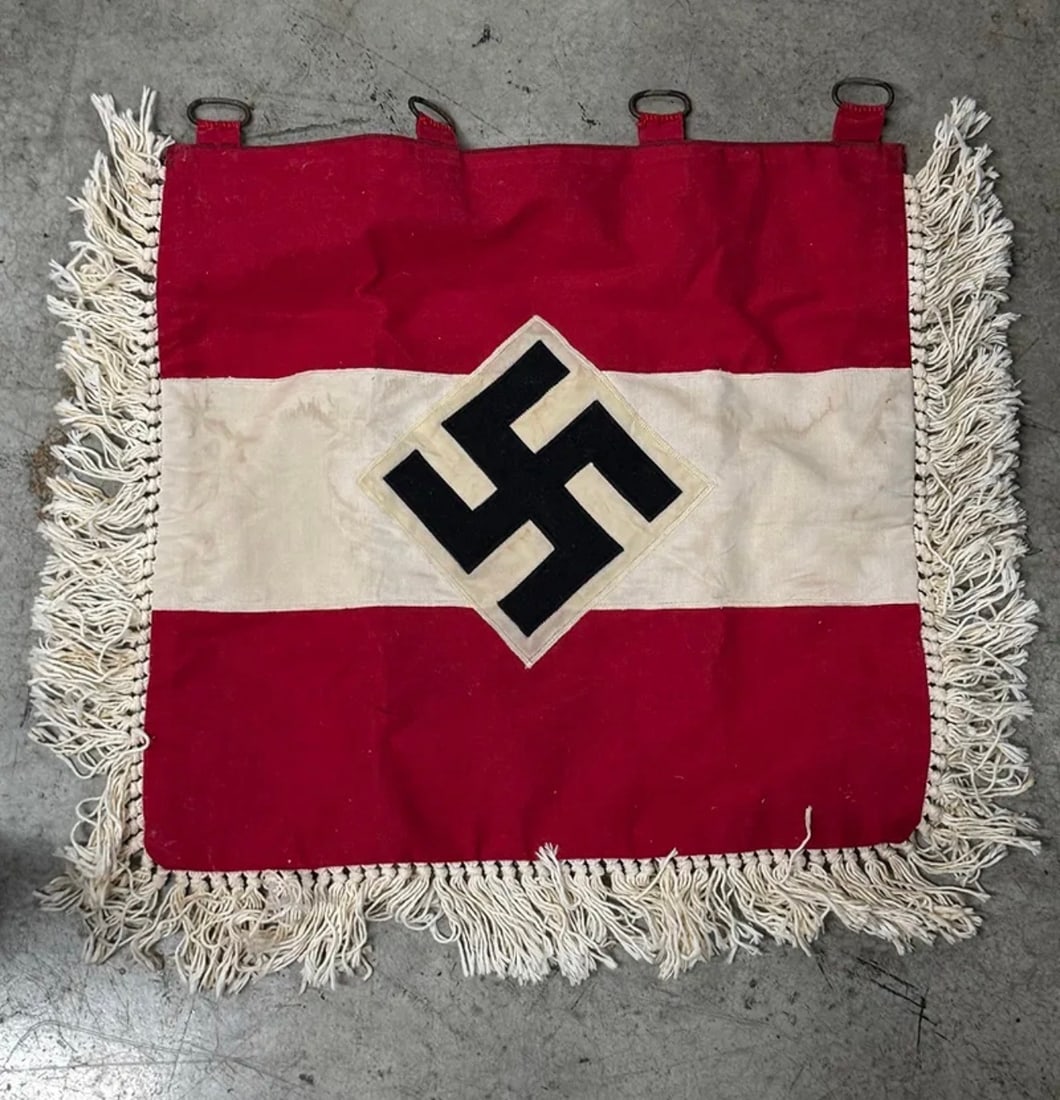 WWII German Hitler Youth (Hitlerjugend) Trumpet Banner: This World War II German Hitler Youth (Hitlerjugend) trumpet banner features the organization's recognizable red and white color scheme with a centrally applied black swastika set within a white diamo