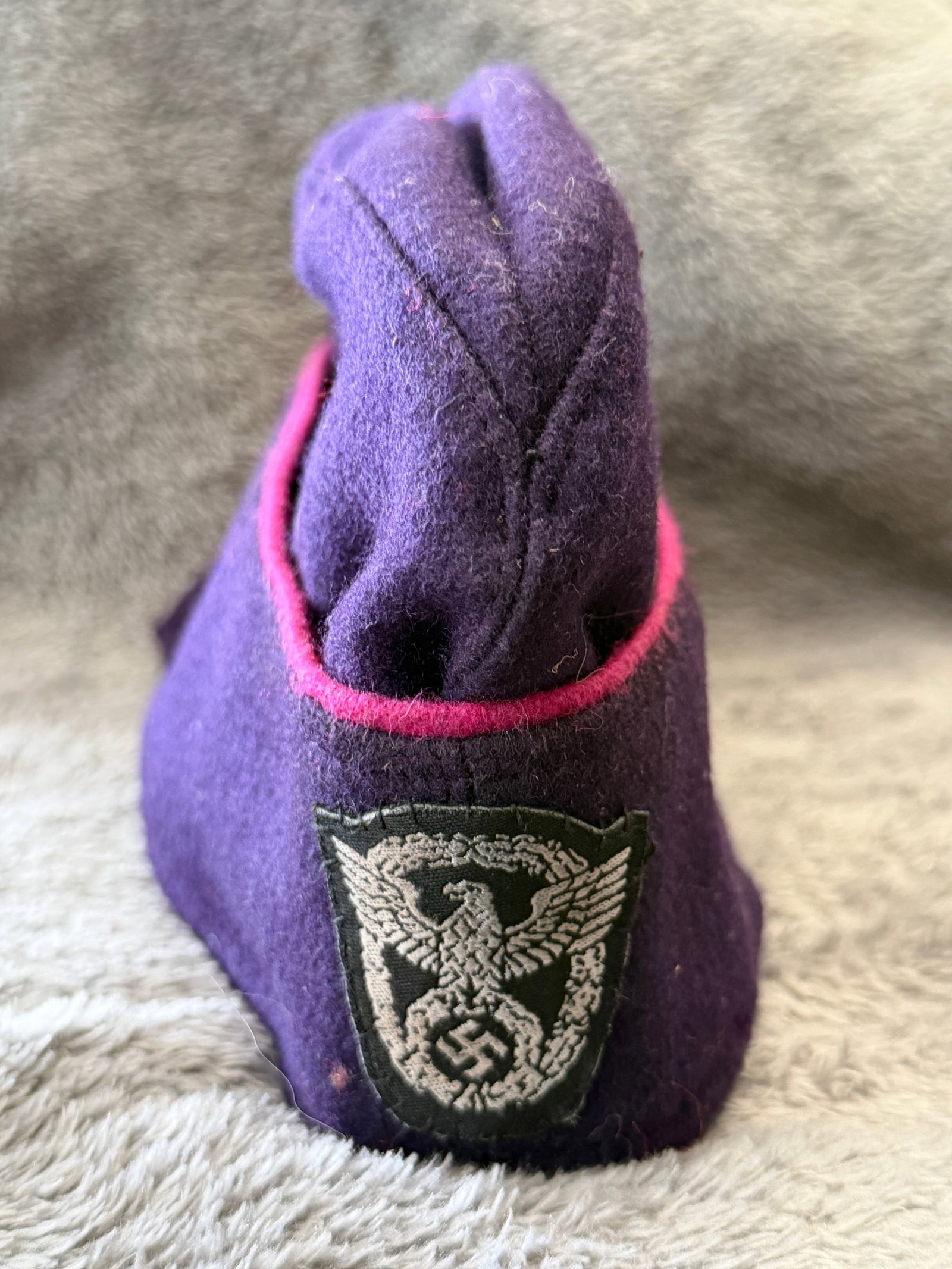 WWII German Luftschutz (Air Raid Protection) Overseas Side Cap: This WWII German Luftschutz overseas side cap is constructed of deep blue wool with distinctive rose-pink piping around the fold-over side panel and retains its machine-woven Luftschutz sleeve-style e