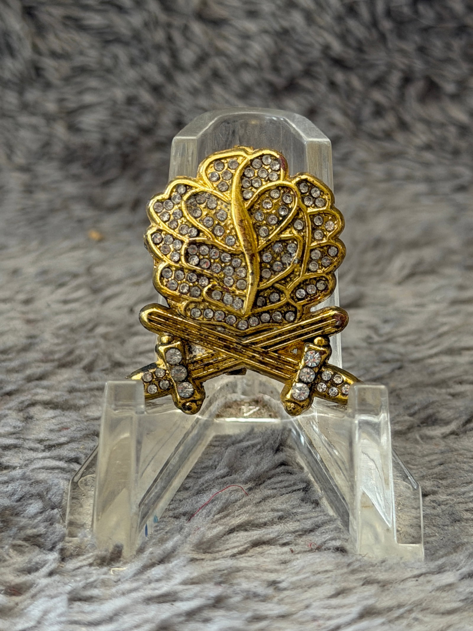WWII German Iron Cross Gold Oak Leaves with Swords Pin: This WWII German Iron Cross Gold Oak Leaves with Swords Pin features an ornate gold-toned design incorporating a stylized cluster of oak leaves above crossed swords, with the entire piece embellished 
