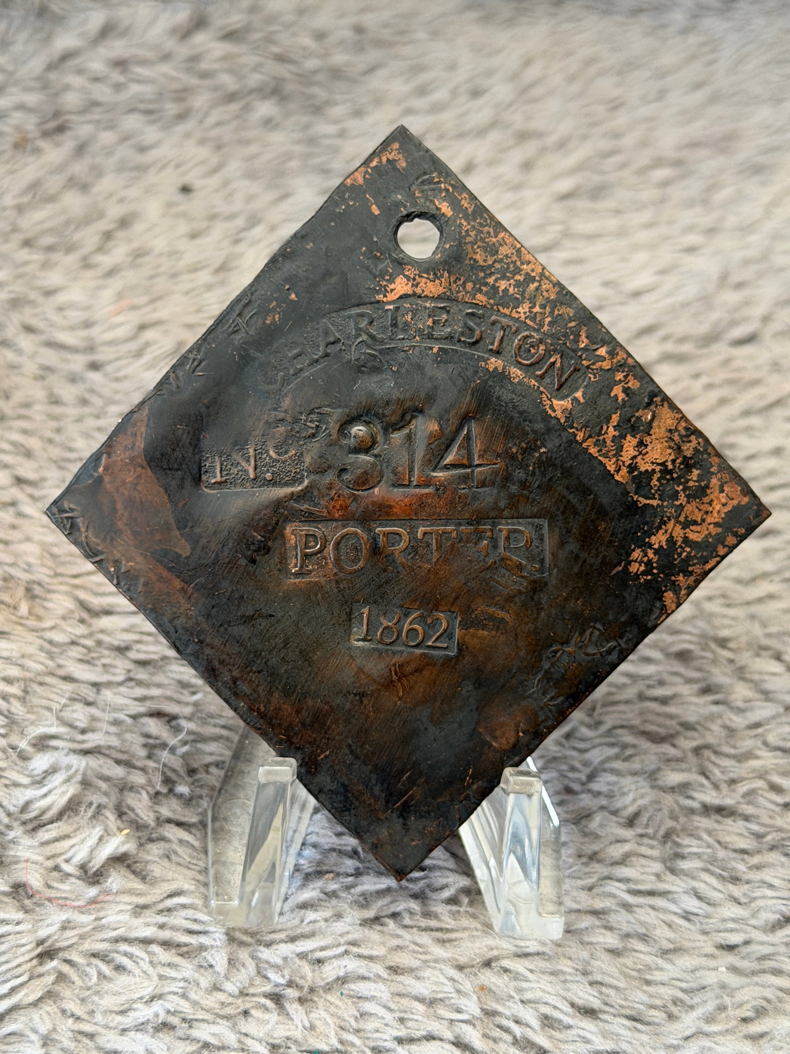 1862 Charleston South Carolina Porter Slave Tag No. 314: This 1862 Charleston, South Carolina Porter Slave Tag No. 314 is a square-shaped municipal identification badge struck with the markings "Charleston," "No. 314," "Porter," and the date 1862. Issued du