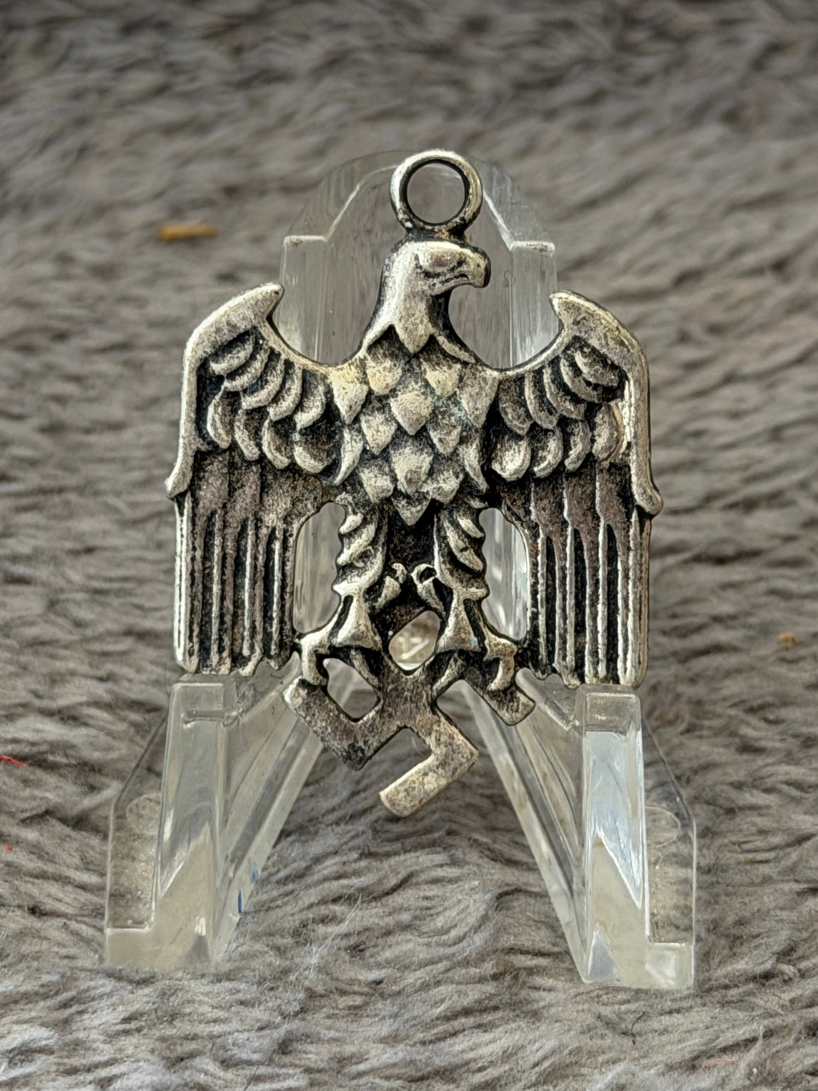 WWII German Third Reich National Eagle Pendant by Gustav Brehmer: This WWII German Third Reich National Eagle Pendant features the national eagle with outstretched wings clutching a swastika in its talons and incorporates an integral suspension loop for wear as a pe