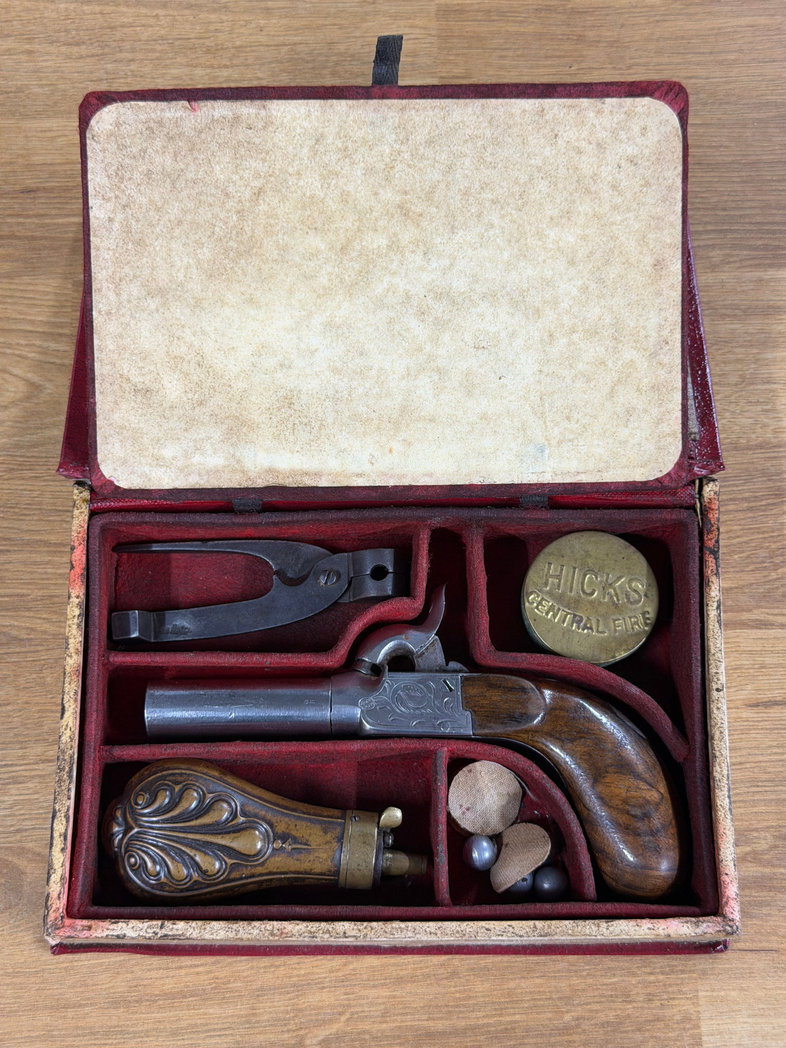 Civil War Mississippi River Law Book Cased Percussion Boot Pistol & Accessories Set: This remarkable Civil War-era disguised traveling cased set is ingeniously housed within a hollowed copy of "Mississippi River Law" by T. Edward Kirkland, concealing a finely engraved single-shot perc