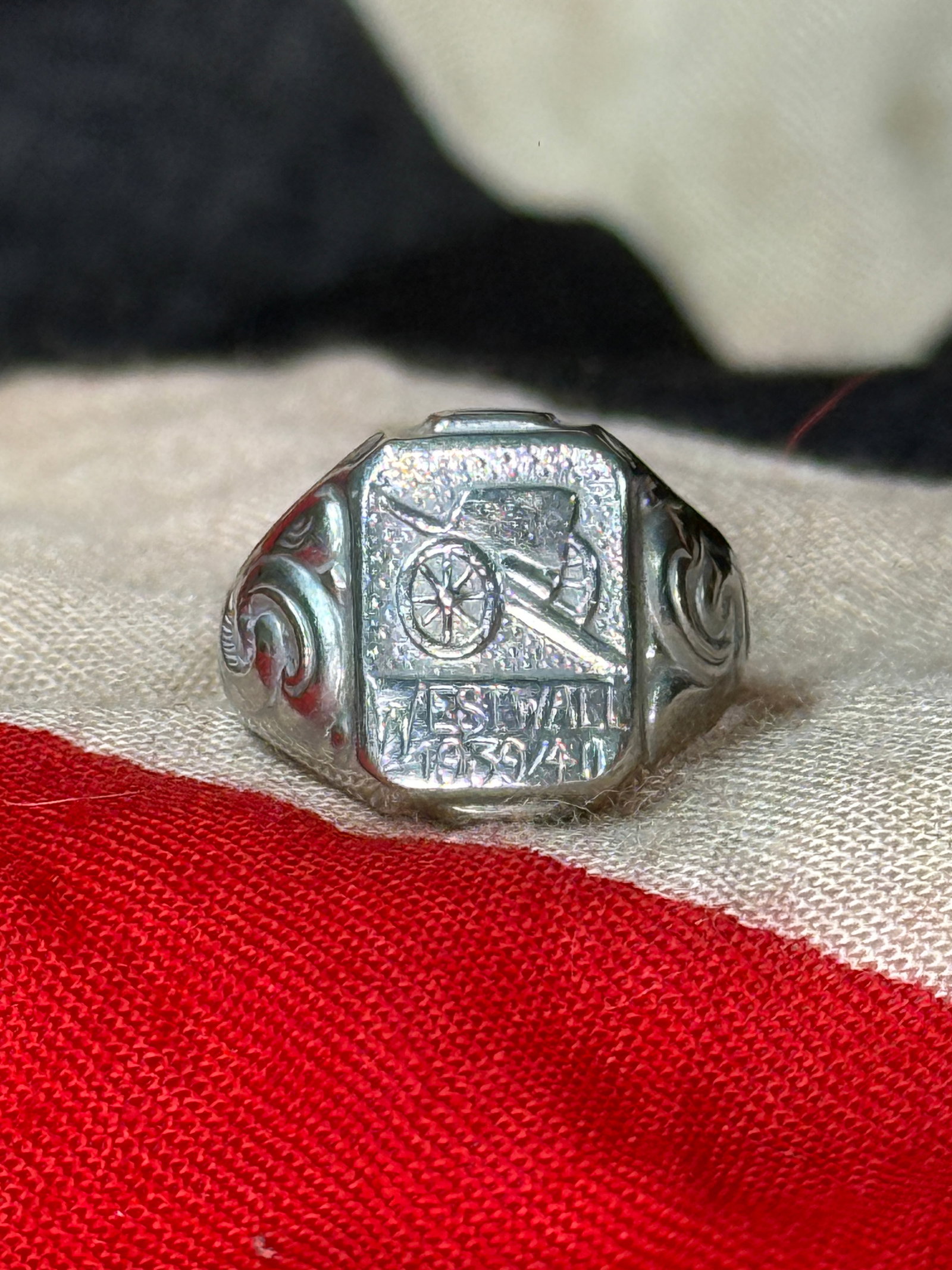 WWII German Westwall (Siegfried Line) Commemorative Ring: This engraved WWII German commemorative ring features a stylized field gun above the inscription "Westwall 1939/40," commemorating Germany's extensive defensive fortification system known as the Siegf