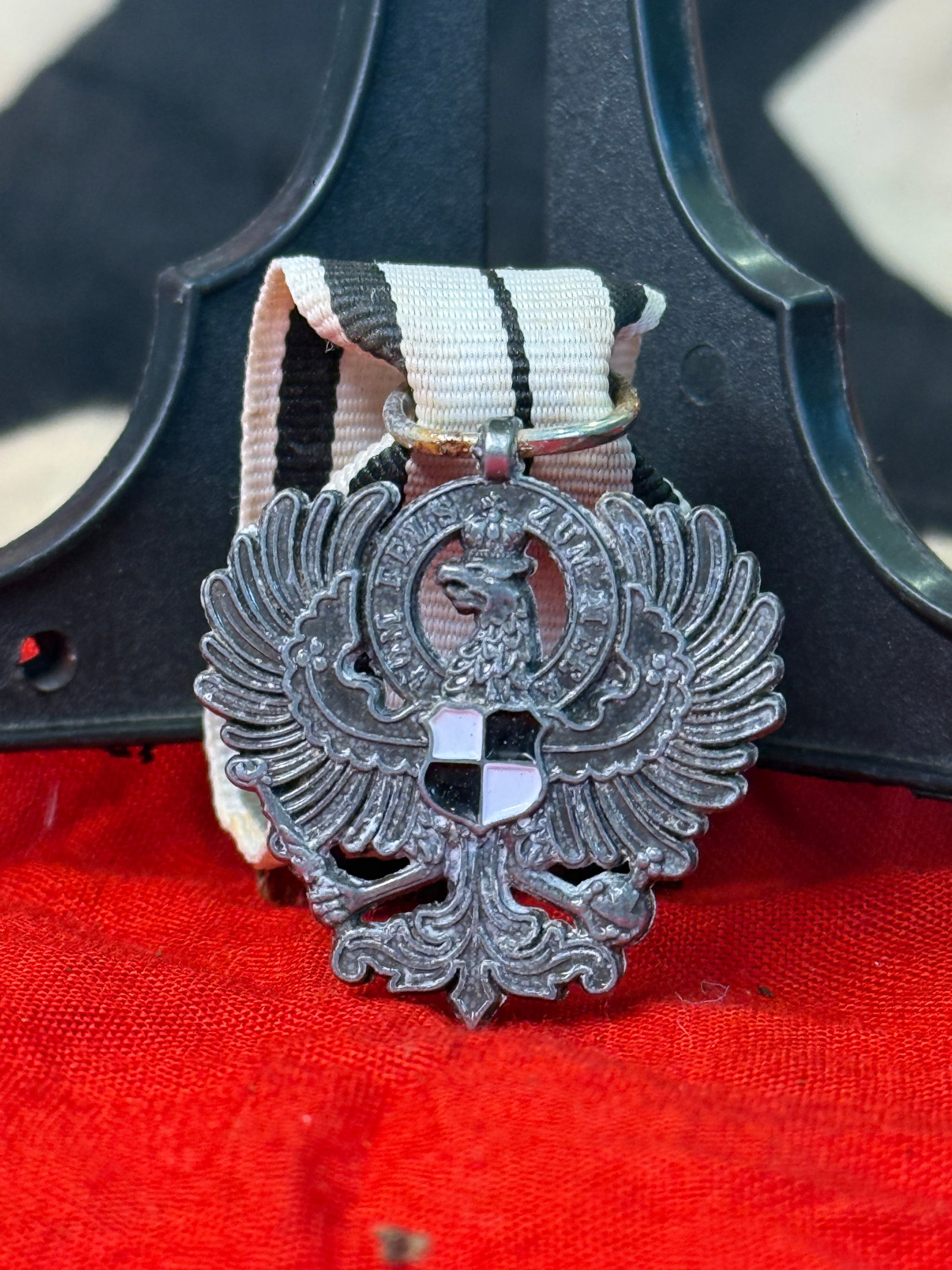 German Prussian Royal House Order "Inhaber" Medal: This German Prussian Royal House Order "Inhaber" medal features the crowned Prussian eagle encircled by the motto "Treue um Treue" on the obverse and is suspended from a traditional black and white ri