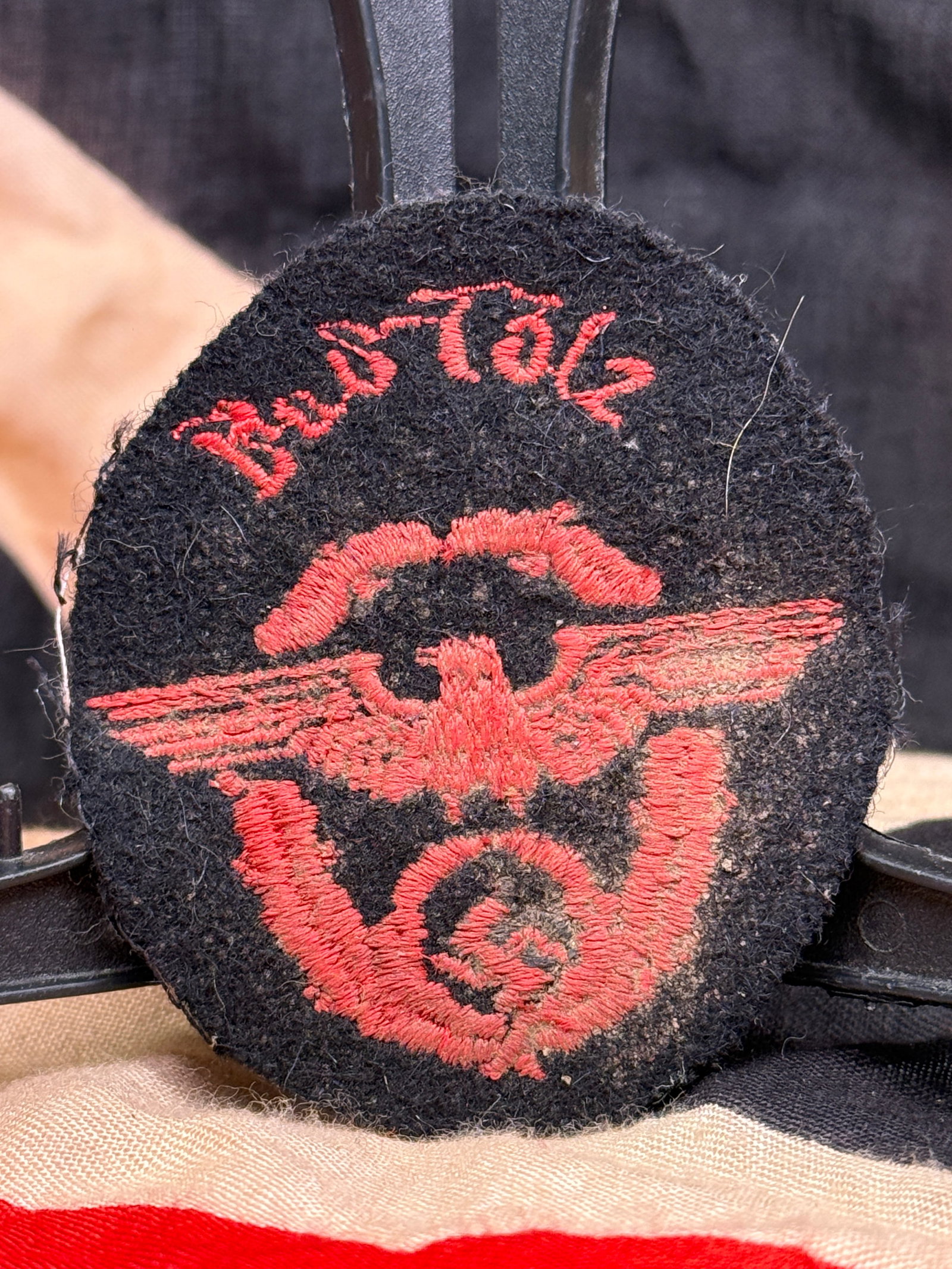 WWII German Feuerschutzpolizei Fire Protection Police Bad Tölz Sleeve Badge: This WWII German Feuerschutzpolizei (Fire Protection Police) sleeve badge is associated with the town of Bad Tölz, Bavaria. The oval-shaped insignia is constructed on a black wool/felt field and feat