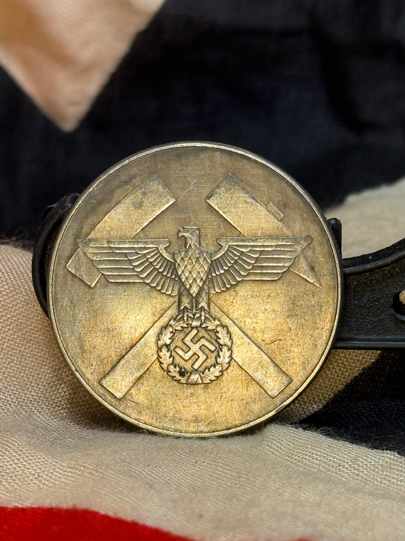 WWII German Mining Rescue Commemorative Medal: This circular commemorative medal features the national eagle above crossed mining hammers on the obverse, while the reverse is inscribed "Für Verdienste im Grubenwehrwesen" ("For Merits in Mine Resc