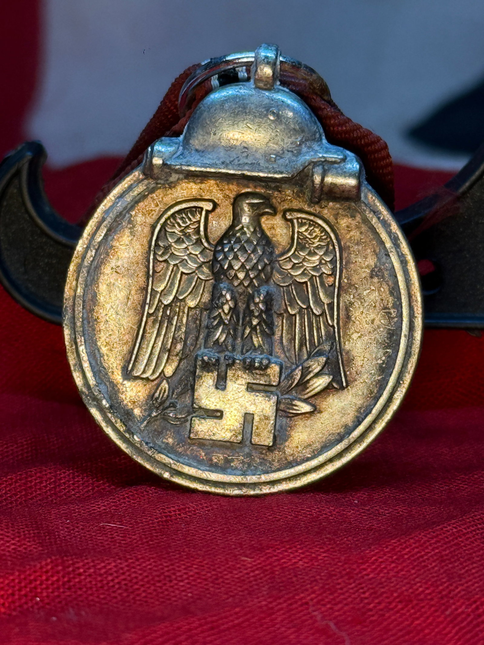 WWII German Eastern Front Medal—“Winter Battle in the East 1941/42: A German campaign medal officially titled the Medaille Winterschlacht im Osten 1941/42. The obverse presents a German eagle and swastika above a laurel branch. The reverse is inscribed “WINTERSCHLAC