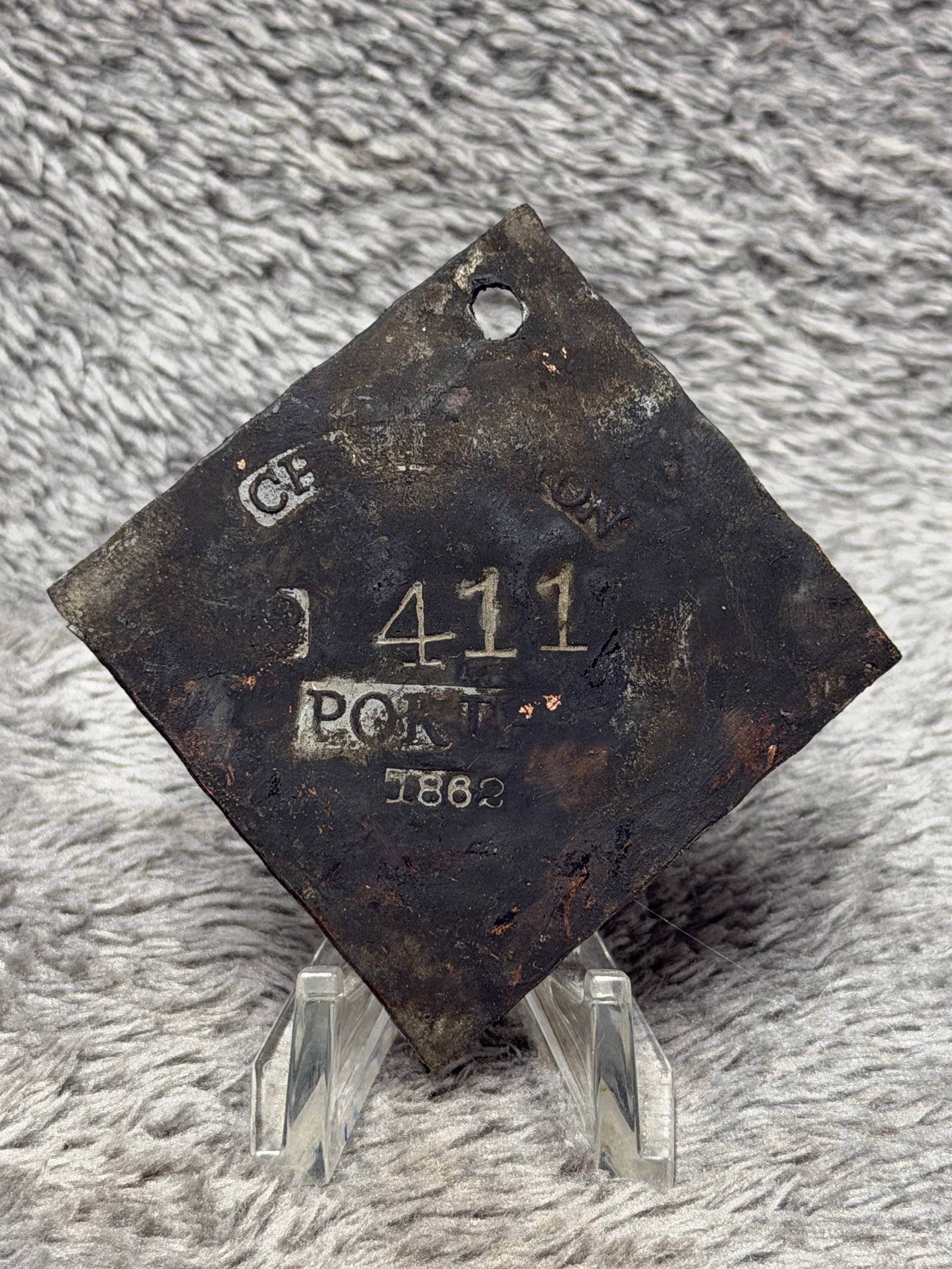 Antique 1862 Charleston Slave Hire Tag Porter No. 411 Copper Badge: Offered is an antique diamond-shaped copper tag marked “CHARLESTON” across the top, “No. 411” at center, “PORTER” below, and “1862” at the bottom. A pierced hole at the