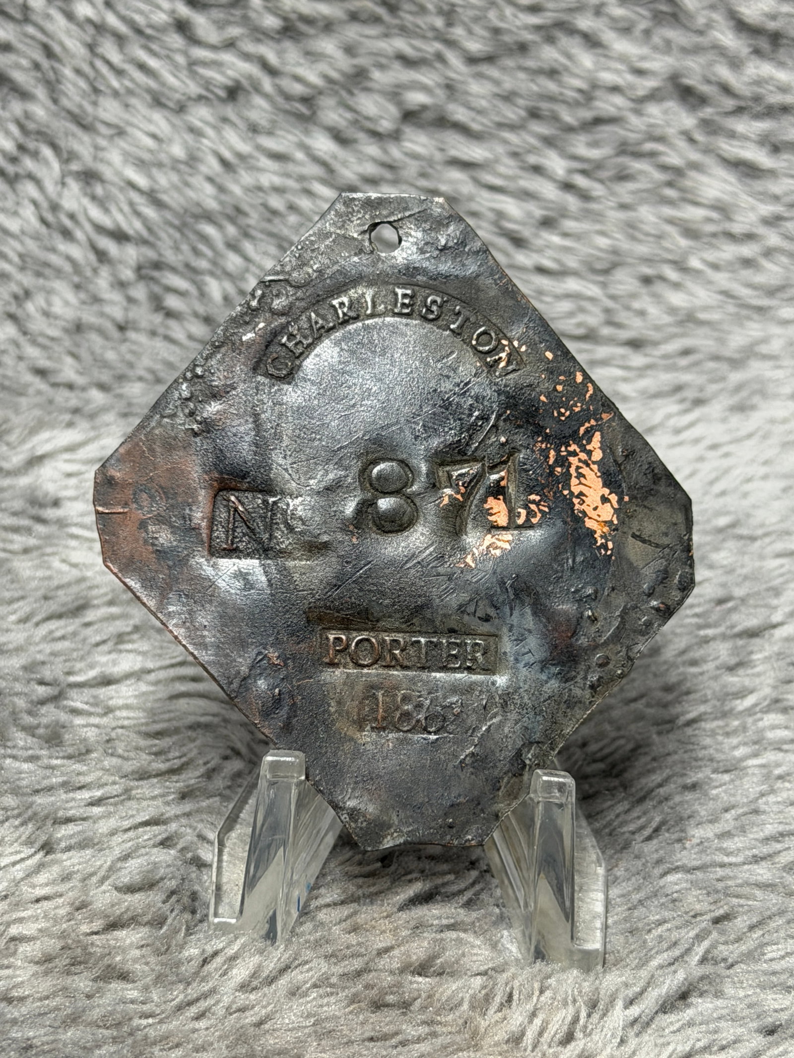 Charleston Porter Tag No. 871 Dated 1861 Copper Occupational Badge: Multi-sided copper tag with a suspension hole near the top and stamped markings including “CHARLESTON,” “No. 871,” “PORTER,” and what appears to be the date “1861.” The