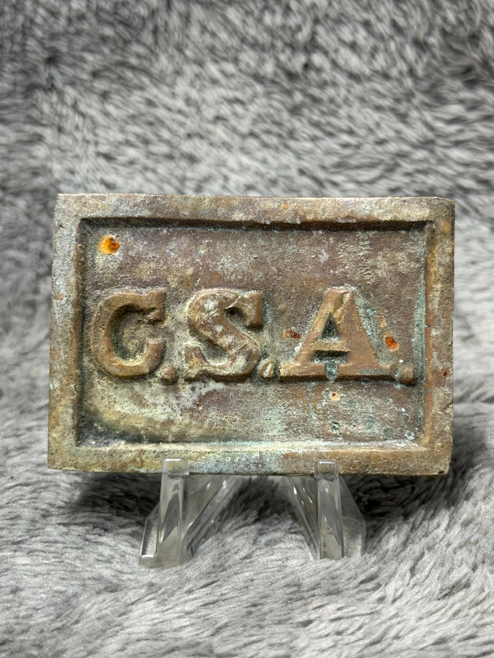 Civil War Confederate States “C.S.A.?? Brass Belt Plate – Balls Bluff, Virginia Provenance: Civil War-style Confederate States belt plate featuring large raised “C.S.A.” lettering across the face within a recessed rectangular field and heavy raised border. The reverse has three integ