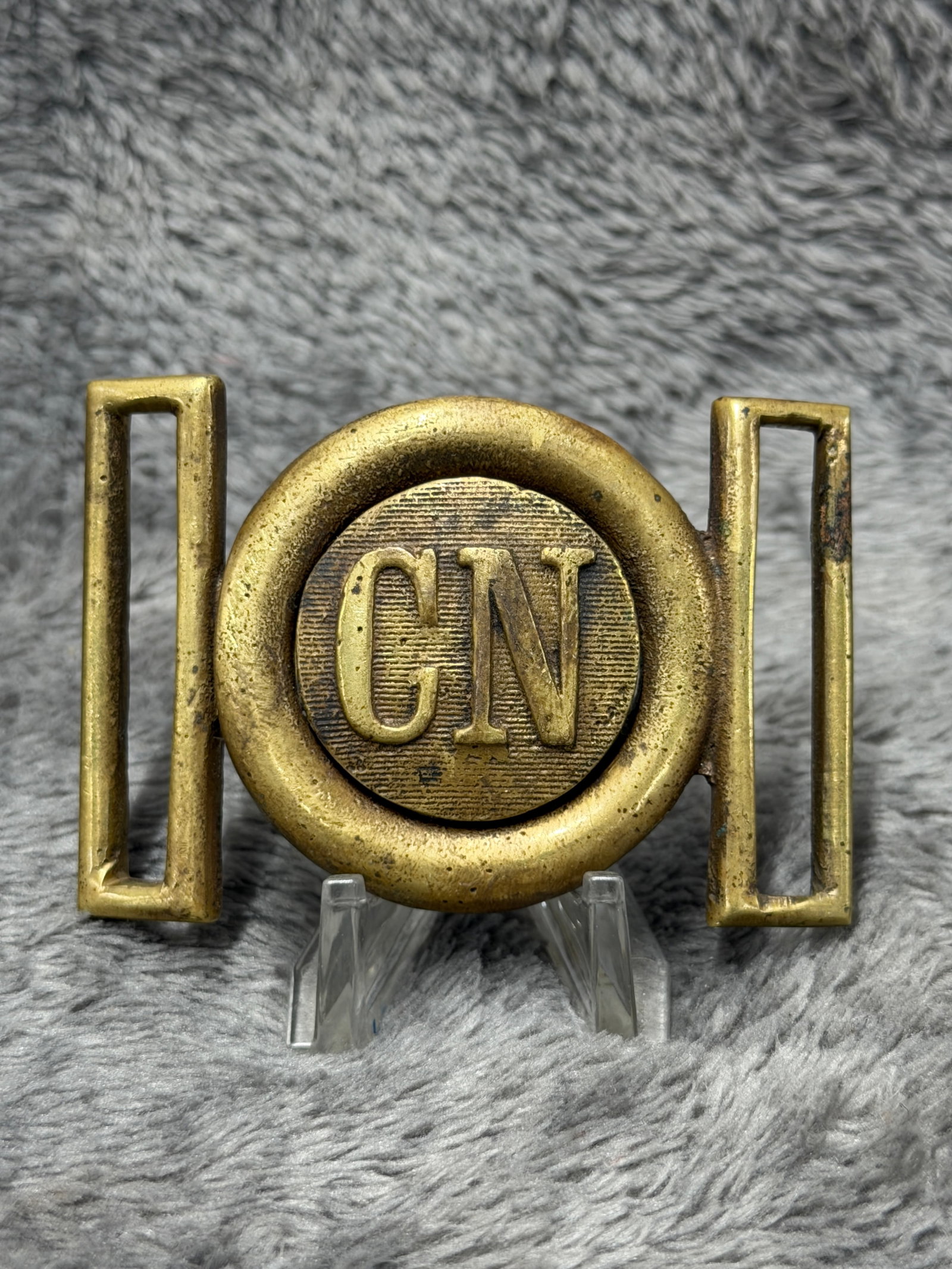 Civil War Confederate “CN?? Brass Two-Piece Interlocking Belt Buckle / Plate: Offered is a brass two-piece interlocking belt buckle featuring a prominent circular center device with raised “CN” lettering over a finely lined background. The buckle is constructed in two m