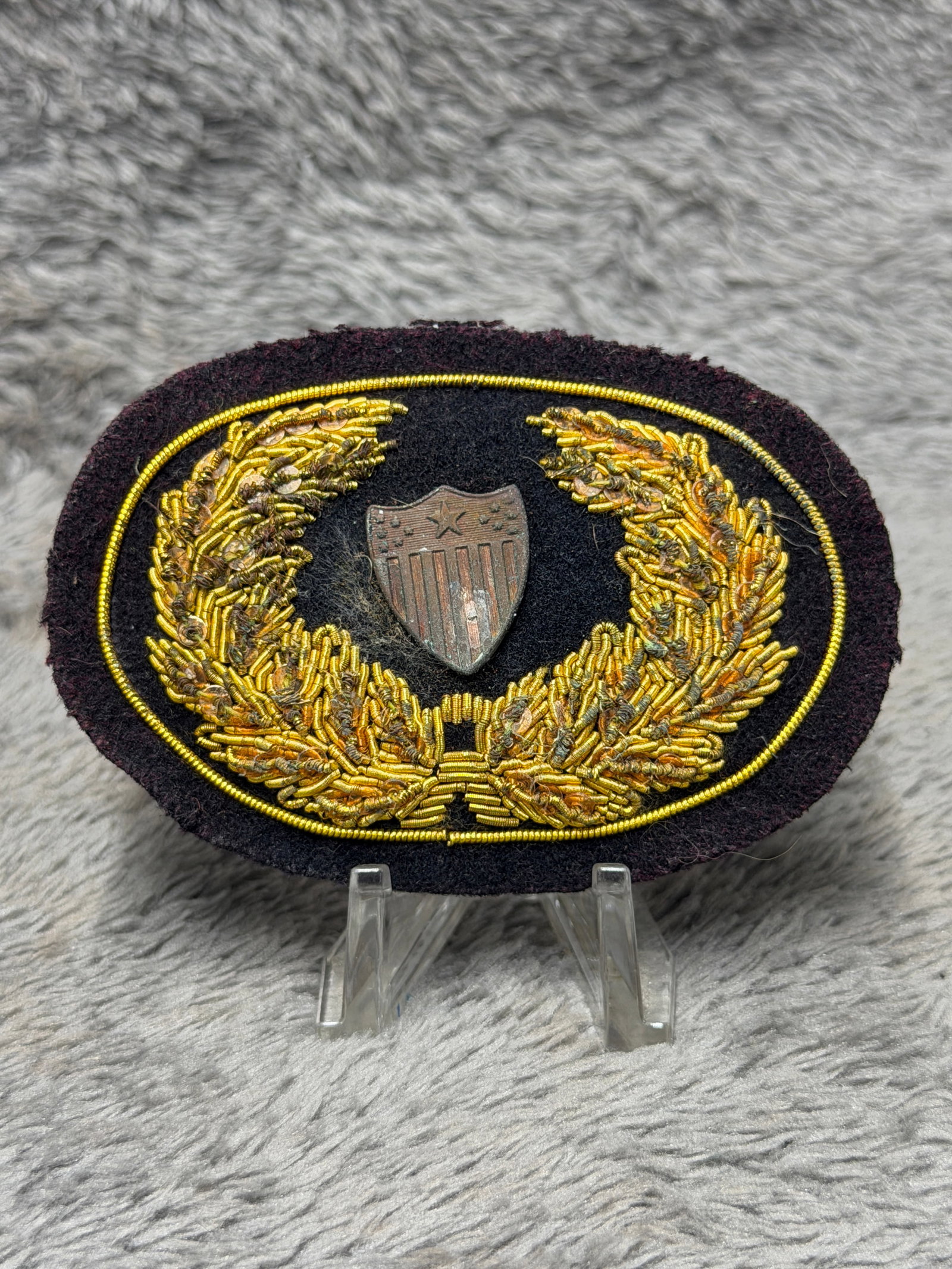 Civil War Topographical Engineer Bullion Headgear Badge John A. Baker: Offered is a Civil War era Topographical Engineer bullion embroidered headgear badge attributed to John A. Baker. This impressive oval insignia features elaborate gold bullion embroidery forming a lar
