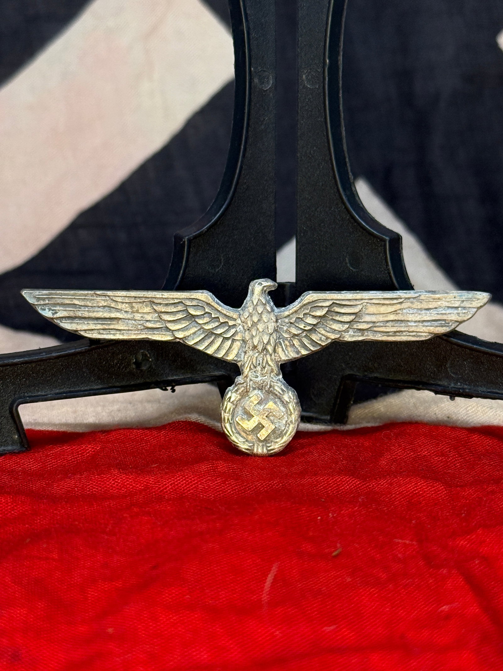 WWII German Wehrmacht Heer Breast Eagle Insignia: This die-struck aluminum breast eagle features the spread-wing Wehrmacht eagle clutching a wreath enclosing a swastika. The reverse retains its original pinback assembly and is marked with a manufactu