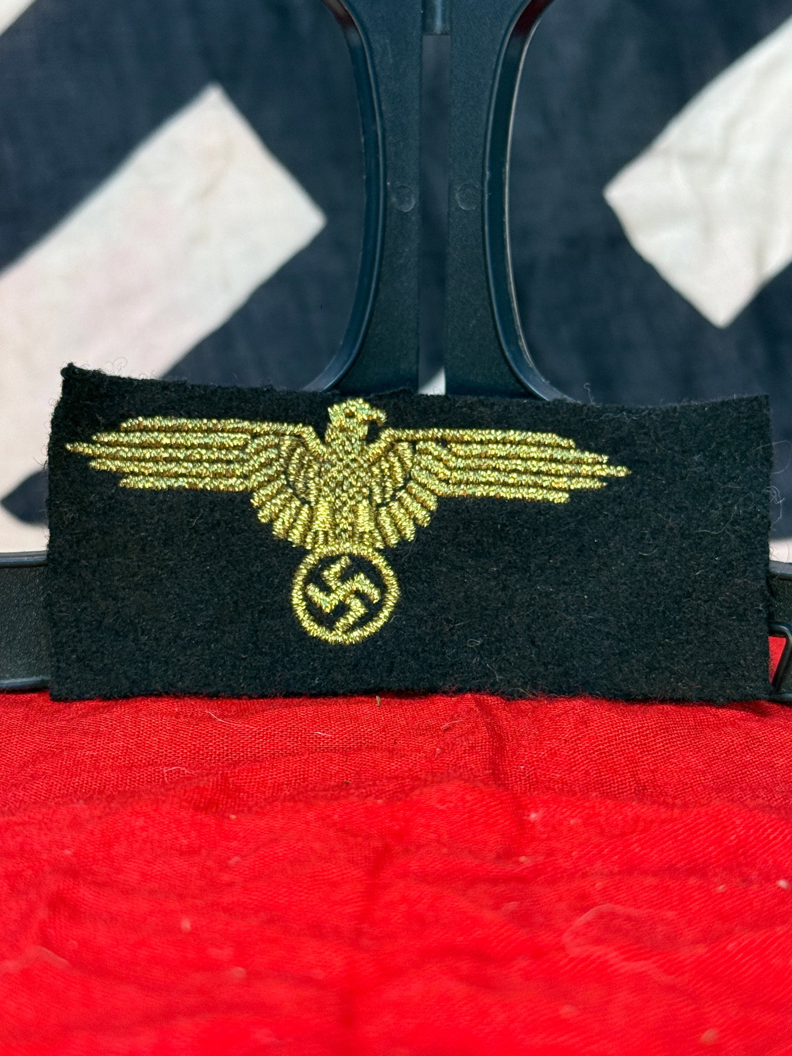 WWII German Kriegsmarine Officer Bullion Breast Eagle: This finely embroidered bullion breast eagle features the national eagle clutching a wreath with swastika executed in gold-colored wire on a black cloth backing. Bullion breast eagles of this style we