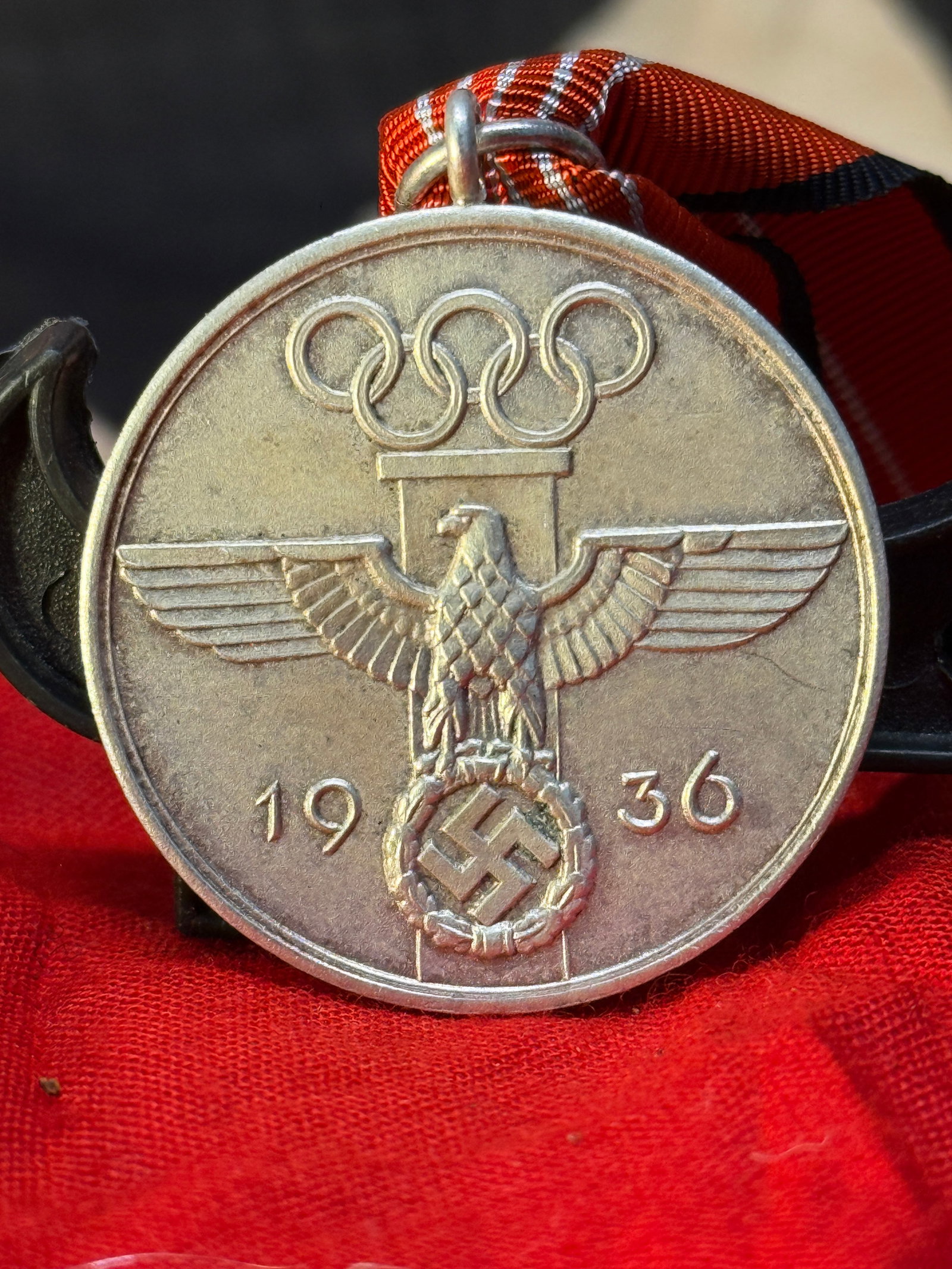 WWII German 1936 Olympic Games Merit Medal: This WWII German 1936 Olympic Games Merit Medal commemorates service connected with the 1936 Olympic Games held in Berlin. The obverse features the German national eagle beneath the Olympic rings with