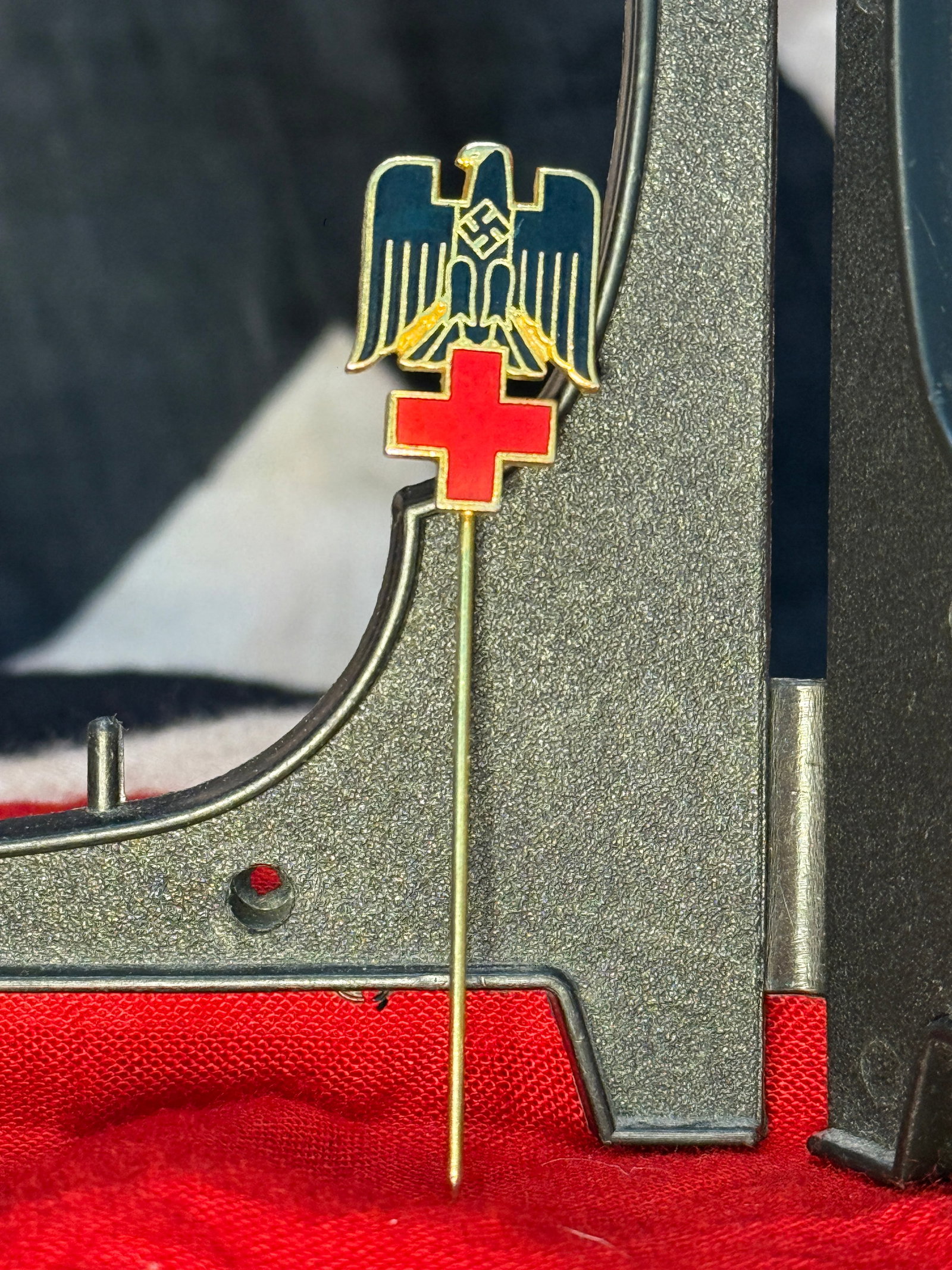WWII German DRK (German Red Cross) Stickpin By Ges. Gesch.: This enameled stickpin combines the German national eagle above a bright red cross, representing the Deutsches Rotes Kreuz (German Red Cross) during the Third Reich period. The reverse is maker marked