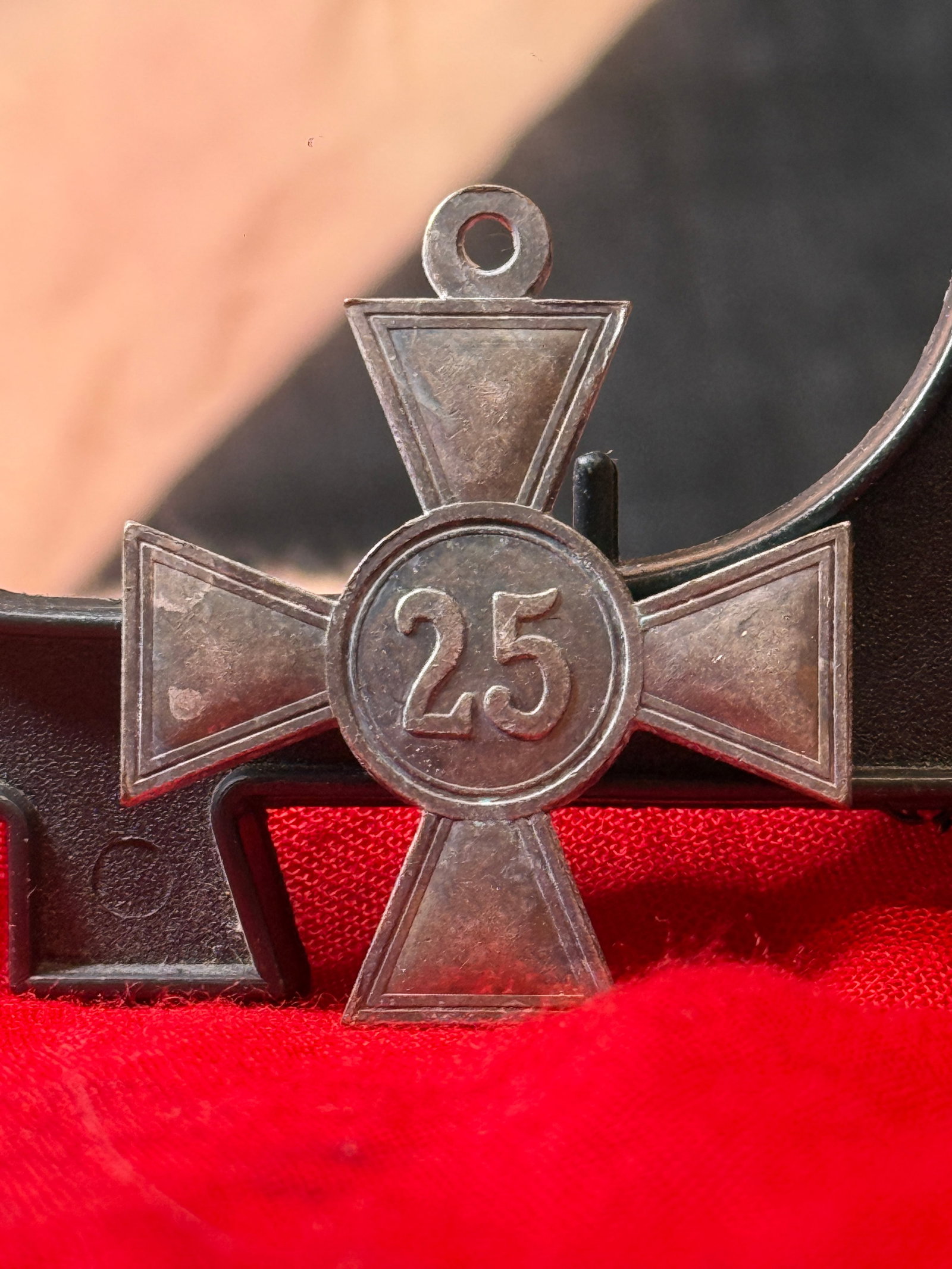 WWI German Imperial 25-Year Long Service Cross Medal: This Imperial German long service decoration features the numeral "25" within a central medallion on the obverse and the Imperial German eagle on the reverse. The medal was awarded in recognition of t