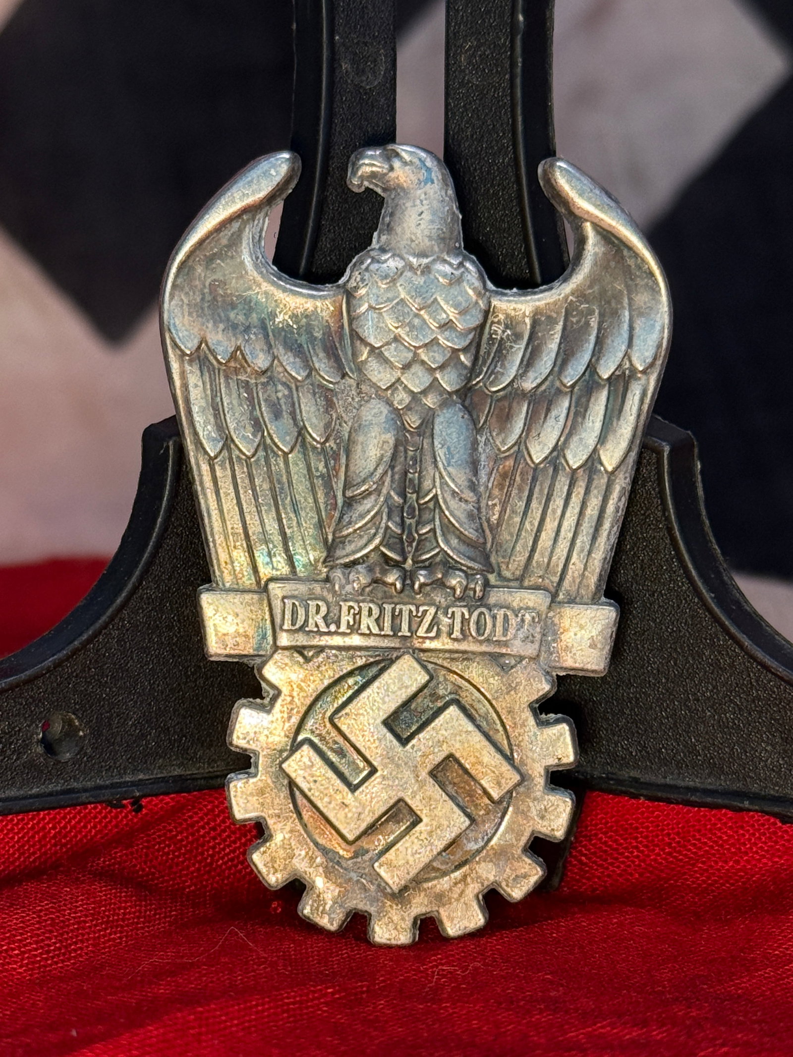 WWII German Organisation Todt Membership Badge: This die-struck badge displays a national eagle above the inscription "DR. FRITZ TODT" with a cogwheel enclosing a swastika below, representing the Organisation Todt, Germany's engineering and constru