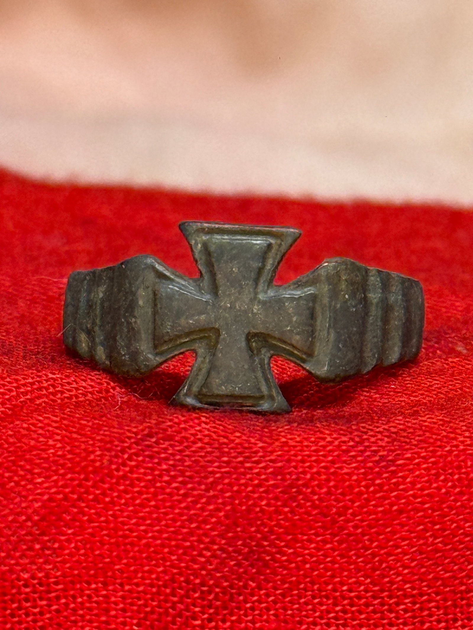 WWI German Iron Cross Patriotic Ring: This cast metal ring features a raised Iron Cross as its centerpiece with decorative stepped shoulders and a smoothly tapered band finished in a dark aged patina. Patriotic rings of this style became 